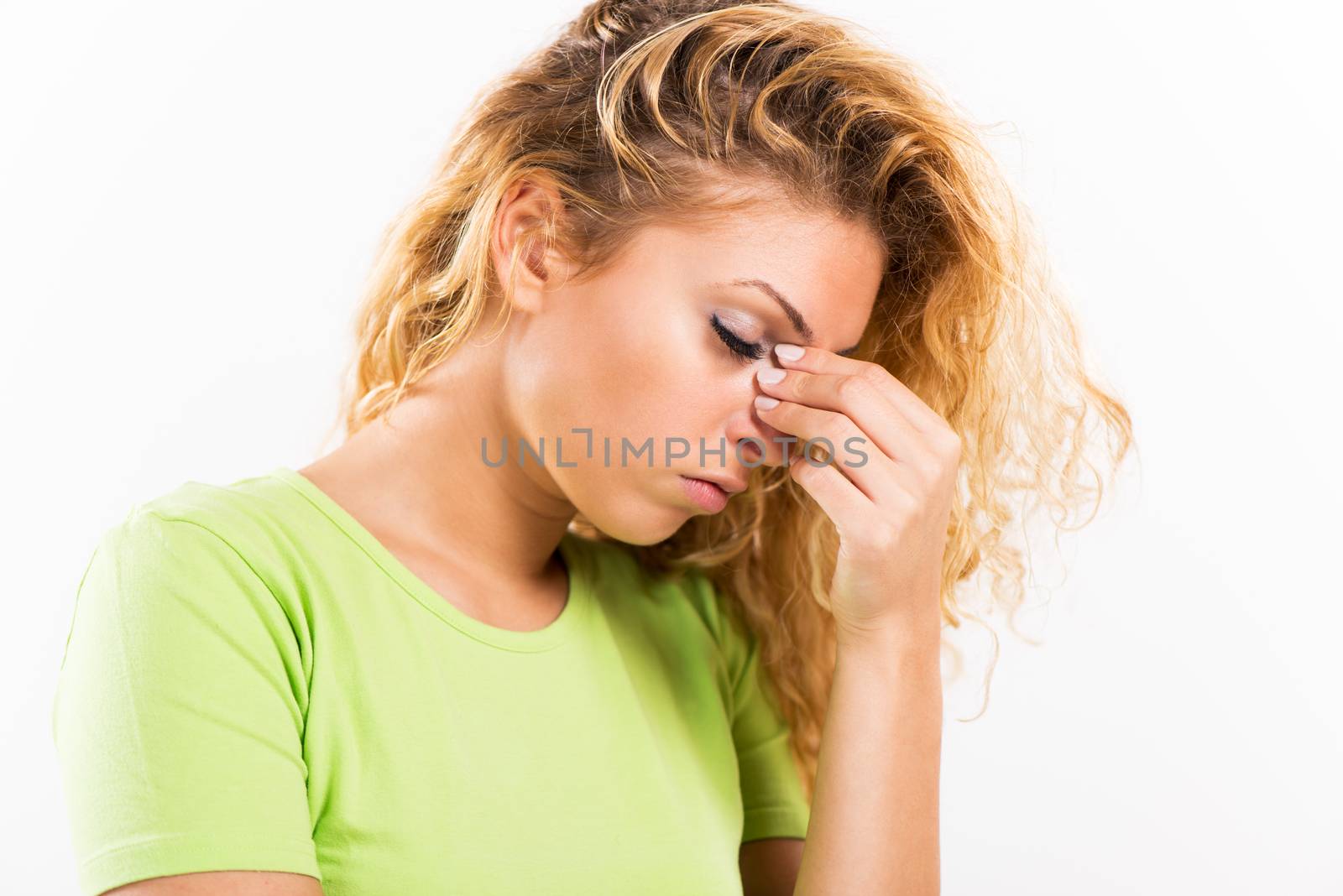 Portrait of young Exhausted woman stressing and keep fingers on forehead. White background.