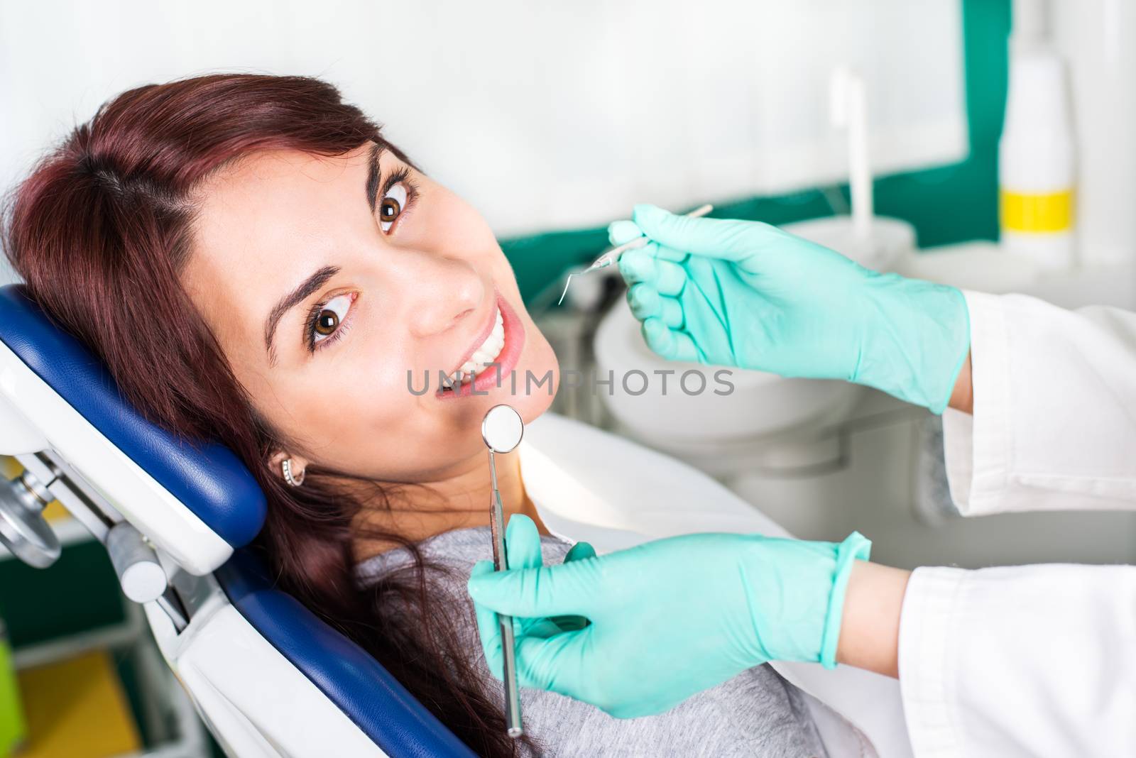 Smiling woman at dentist by MilanMarkovic78