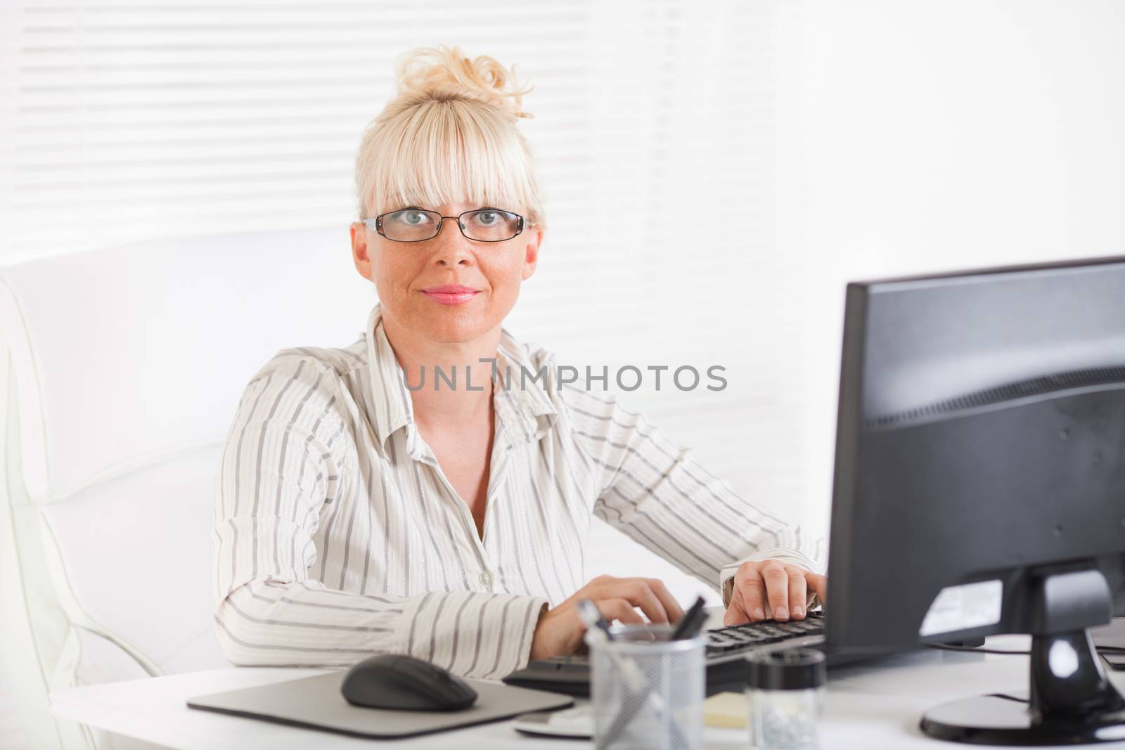 Beautiful mature Business woman working in the office