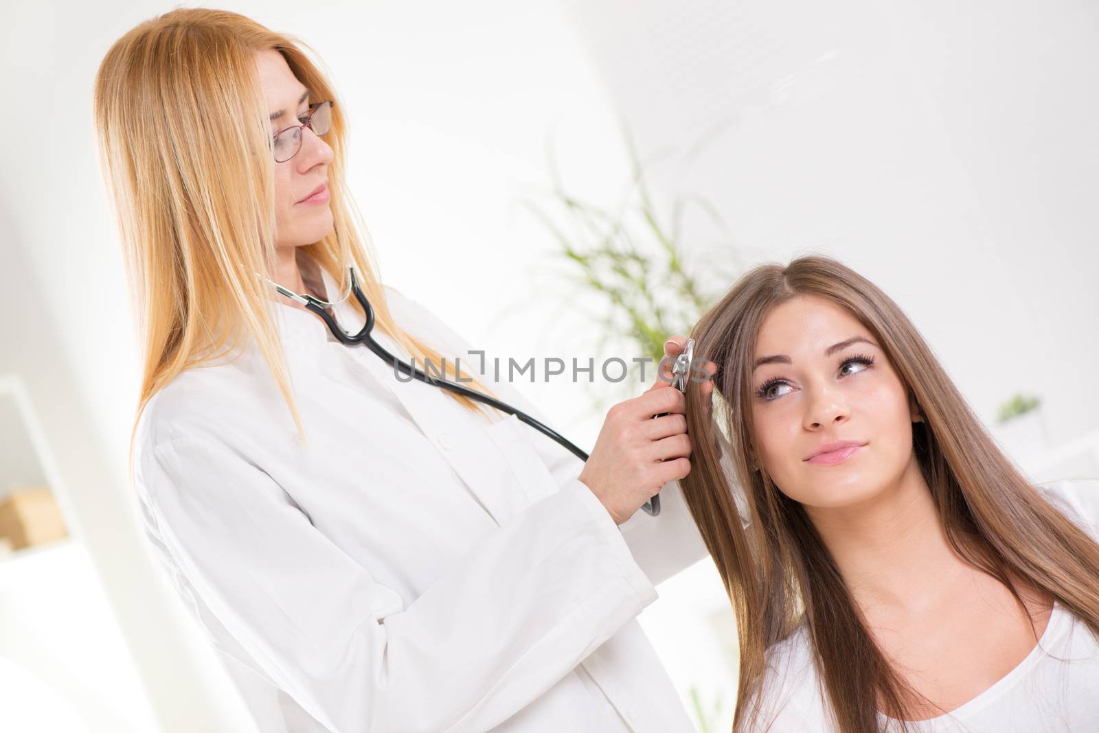 Cute young girl have Medical examination of Damaged Hair.