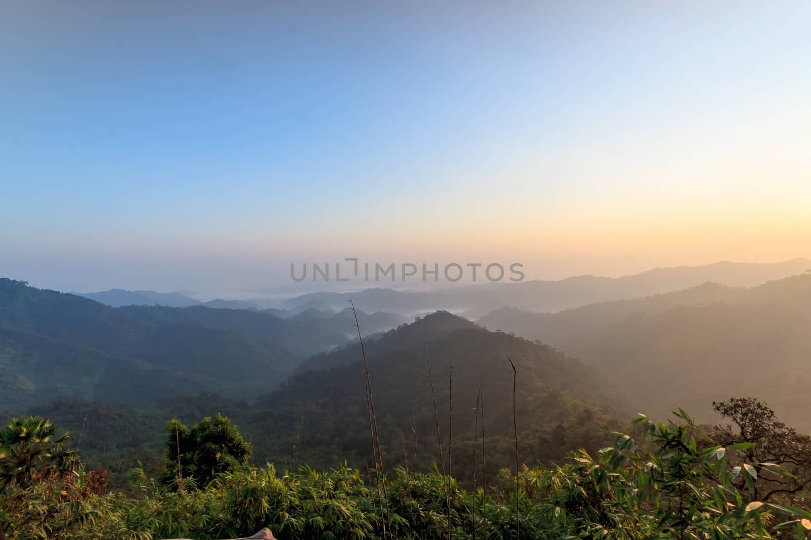 Beautiful sunrise in the hills rain forests. by ngungfoto