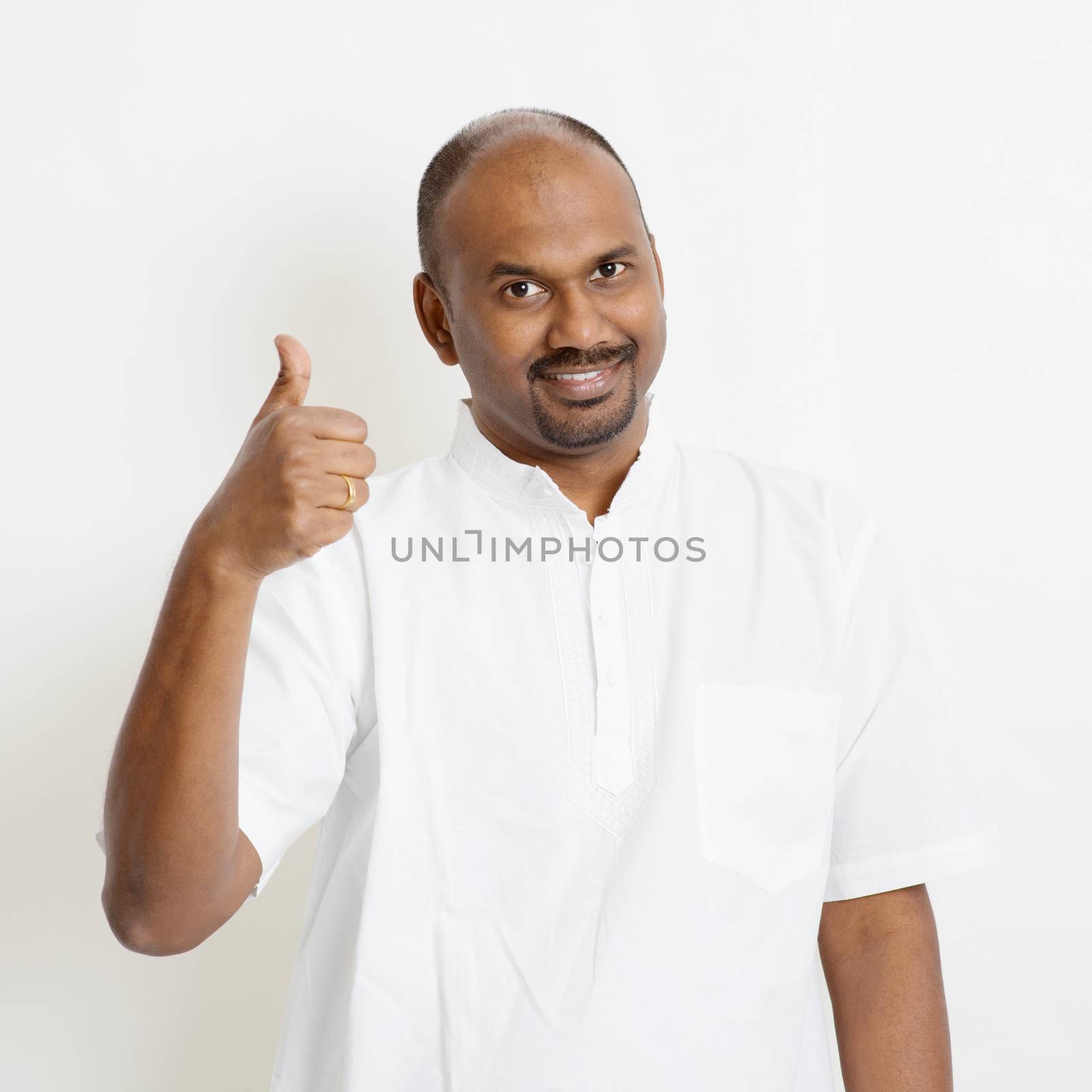 Casual mature Indian people thumb up by szefei