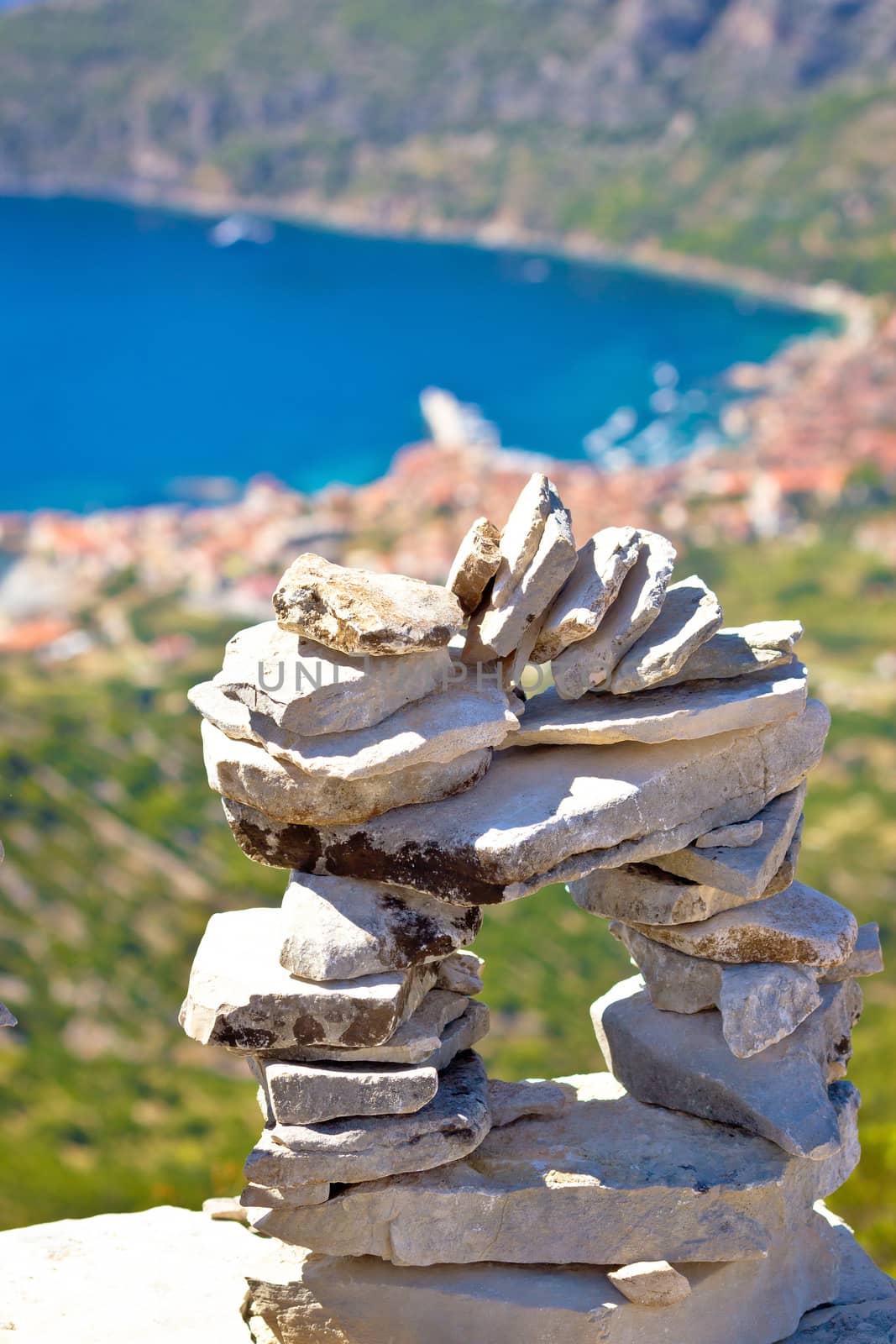 Tourist made stone statue above Komiza bay on Vis island, Dalmatia, Croatia