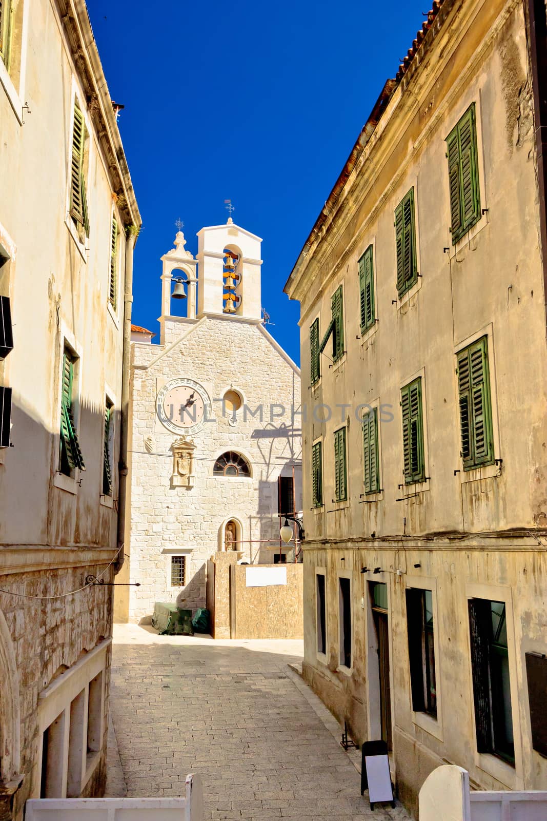 Stone chapel in streets of Sibenik vertical view, Dalmatia, Croatia