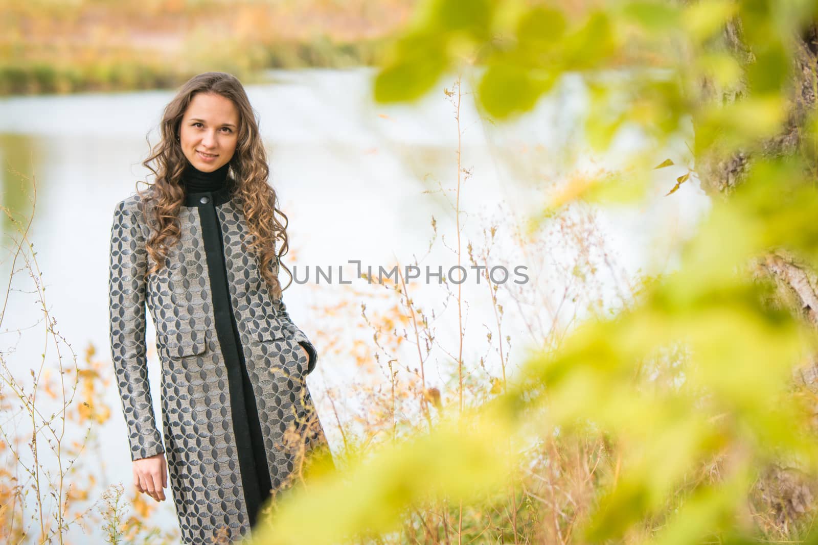 Twenty-five young beautiful girl walks by Europeans autumn forest