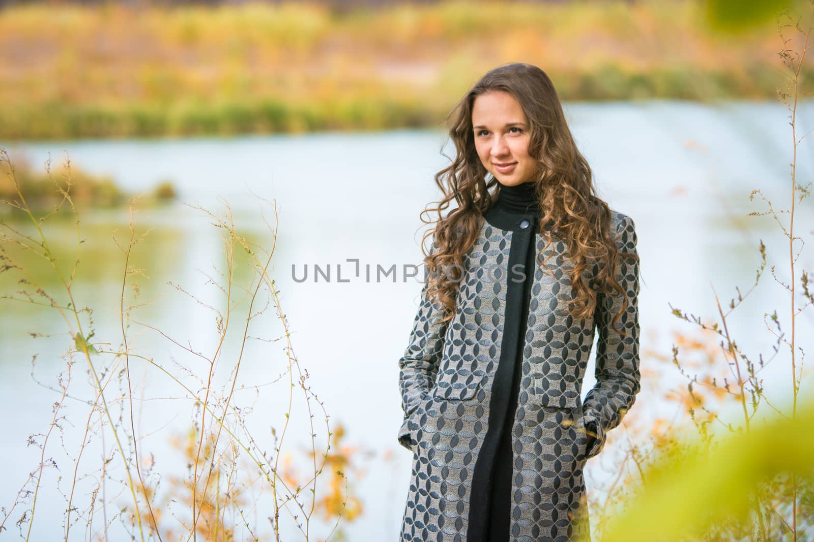 Twenty-five young beautiful girl walks by Europeans autumn forest