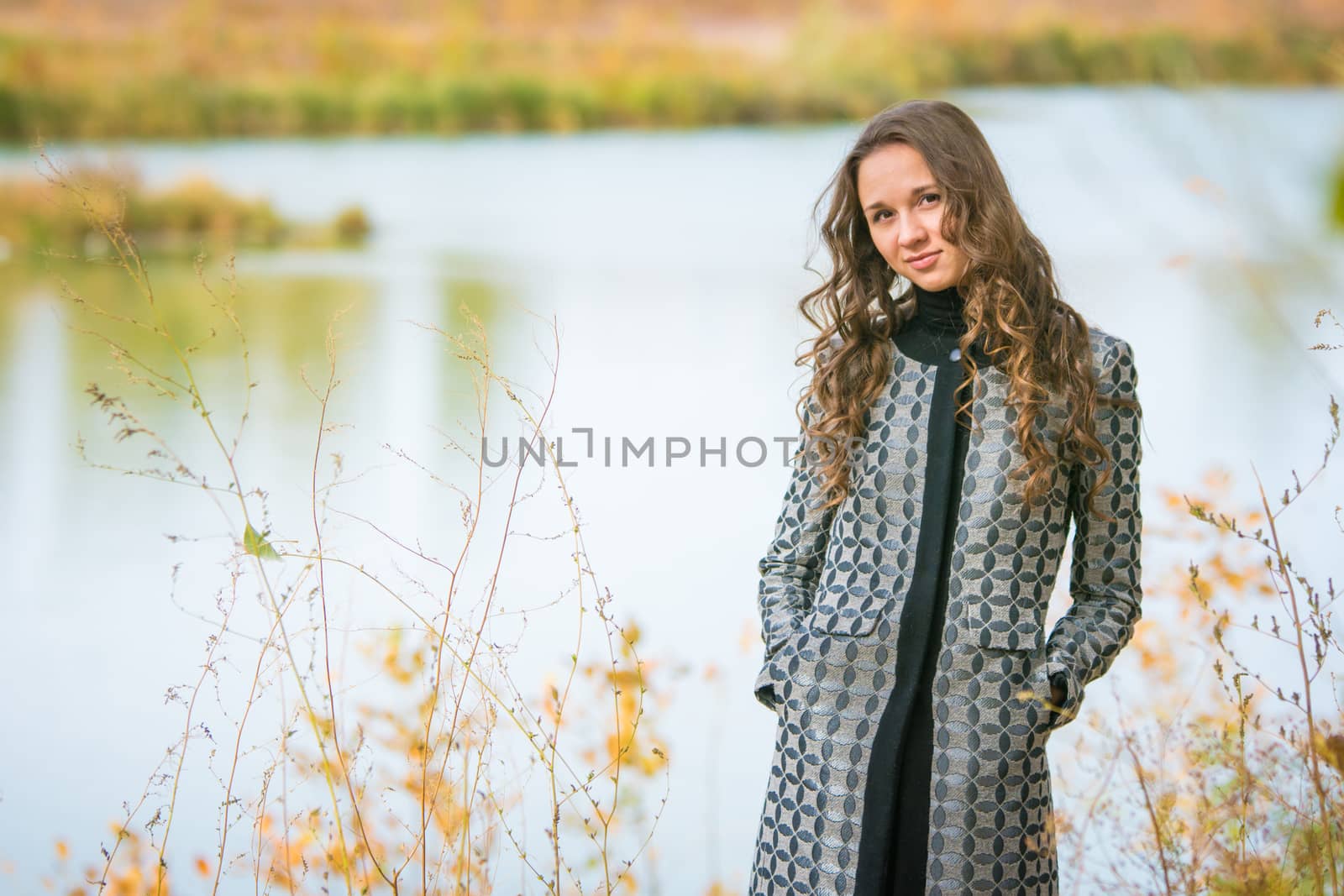 Twenty-five young beautiful girl walks by Europeans autumn forest