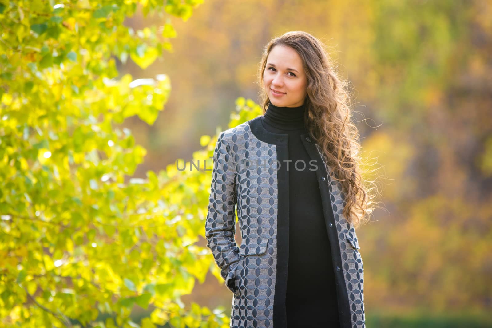 Twenty-five young beautiful girl walks by Europeans autumn forest