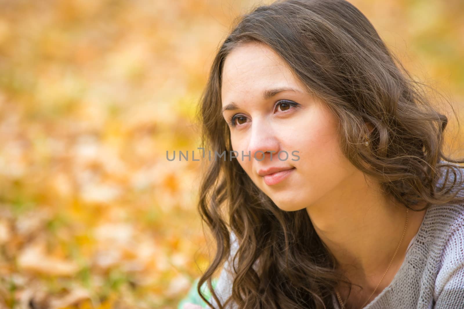 Twenty-five young beautiful girl walks by Europeans autumn forest