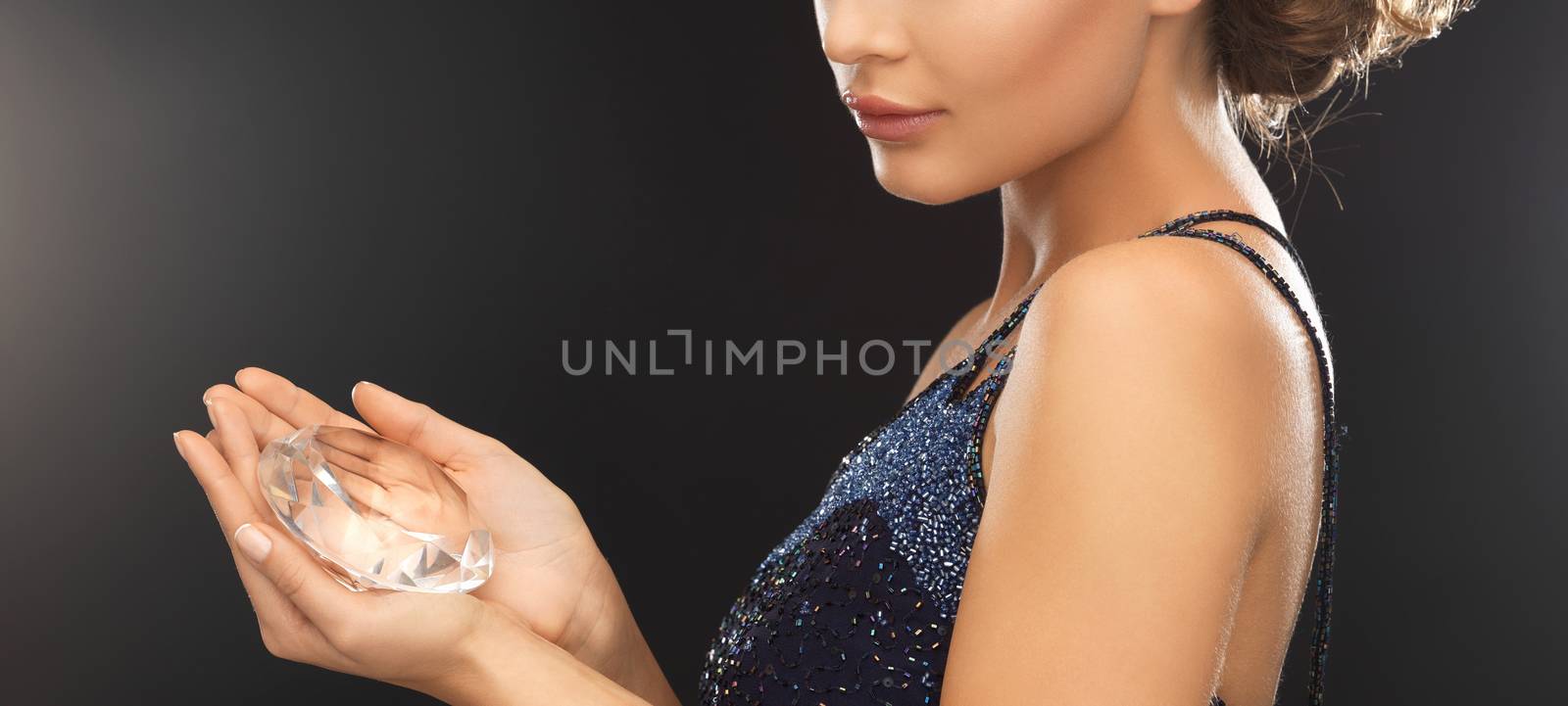 beautiful woman in evening dress with big diamond