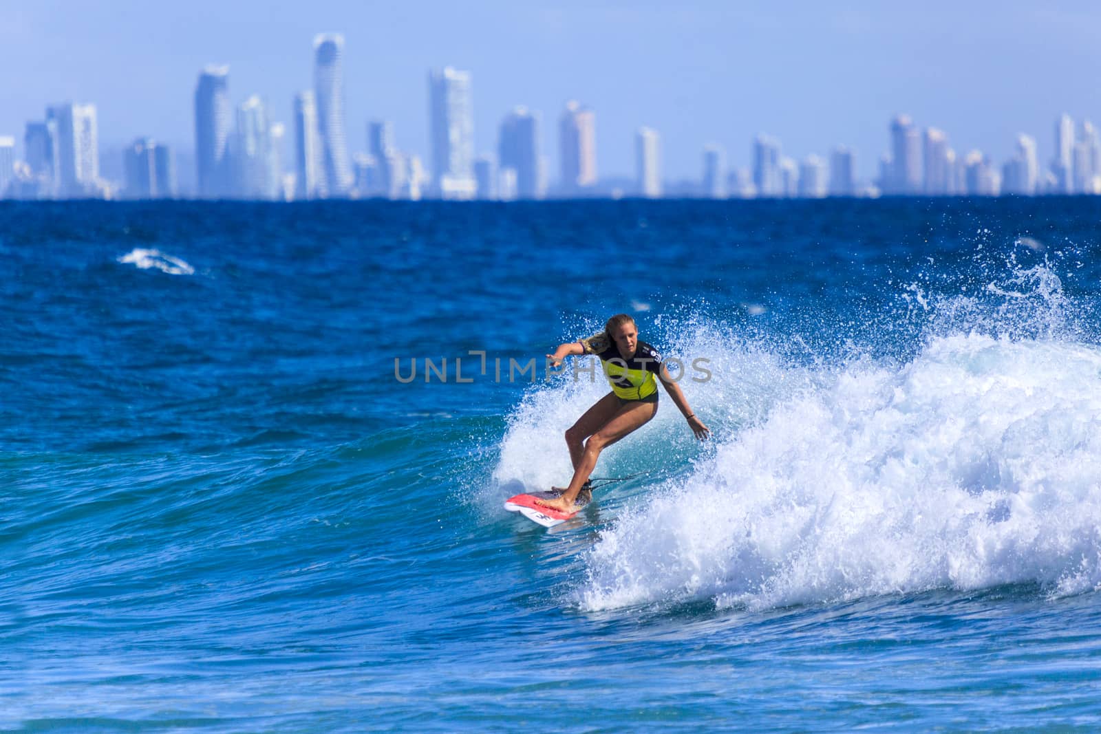 SNAPPER ROCKS, GOLD COAST, AUSTRALIA - 9 MARCH: Unidentified Surfer races the Quiksilver & Roxy Pro World Title Event. 9 March 2013, Snapper Rocks, Gold Coast, Australia