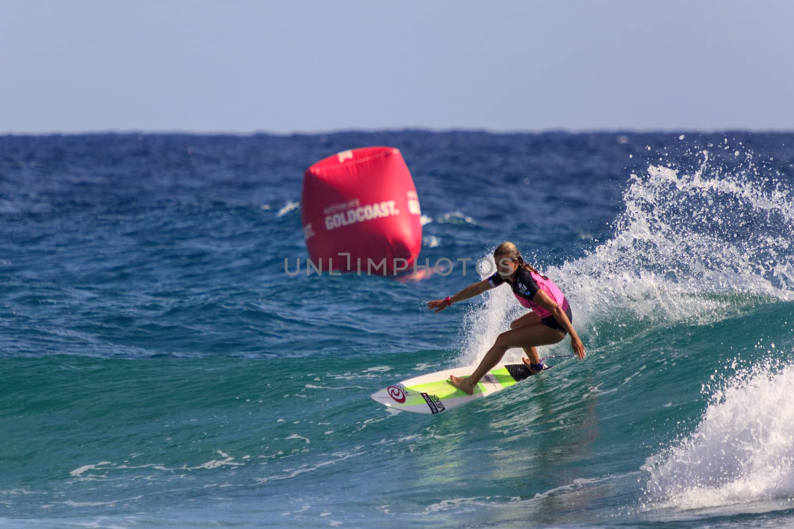 SNAPPER ROCKS, GOLD COAST, AUSTRALIA - 9 MARCH: Unidentified Surfer races the Quiksilver & Roxy Pro World Title Event. 9 March 2013, Snapper Rocks, Gold Coast, Australia