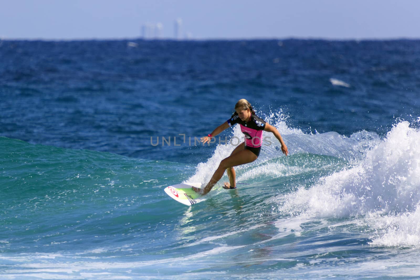 SNAPPER ROCKS, GOLD COAST, AUSTRALIA - 9 MARCH: Unidentified Surfer races the Quiksilver & Roxy Pro World Title Event. 9 March 2013, Snapper Rocks, Gold Coast, Australia