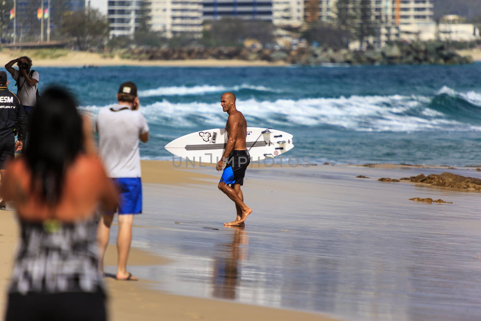 SNAPPER ROCKS, GOLD COAST, AUSTRALIA - 9 MARCH: Unidentified Surfer races the Quiksilver & Roxy Pro World Title Event. 9 March 2013, Snapper Rocks, Gold Coast, Australia