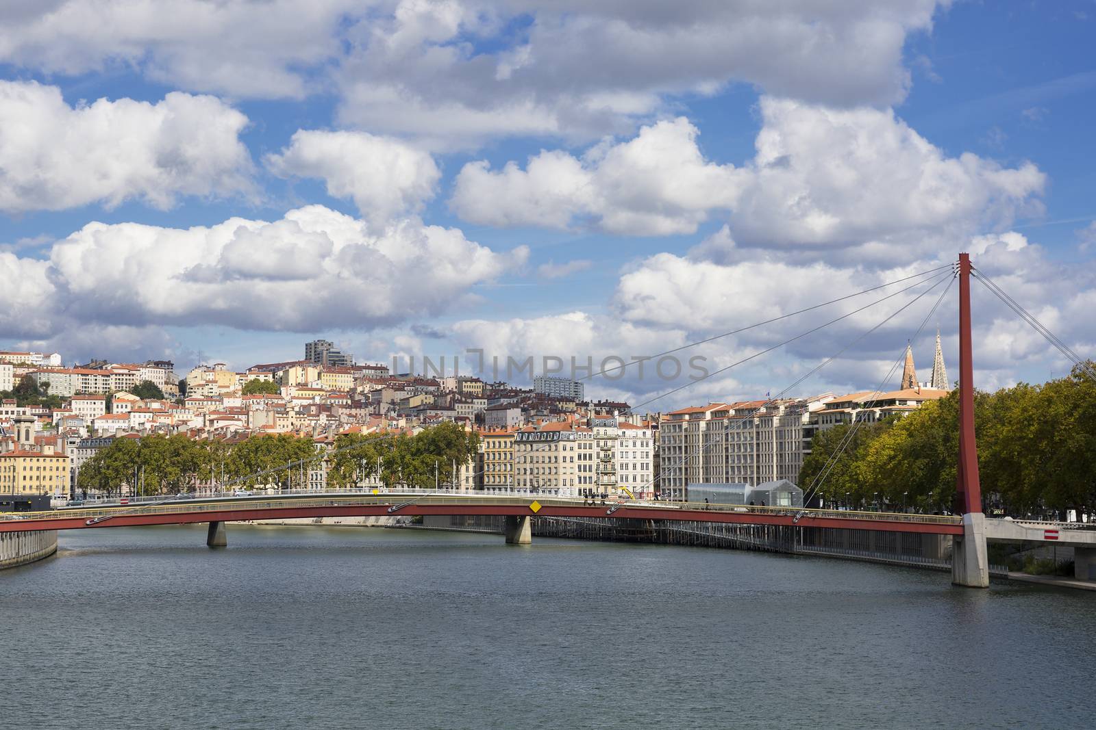 View of Lyon with red footbridge over Saone river, France.