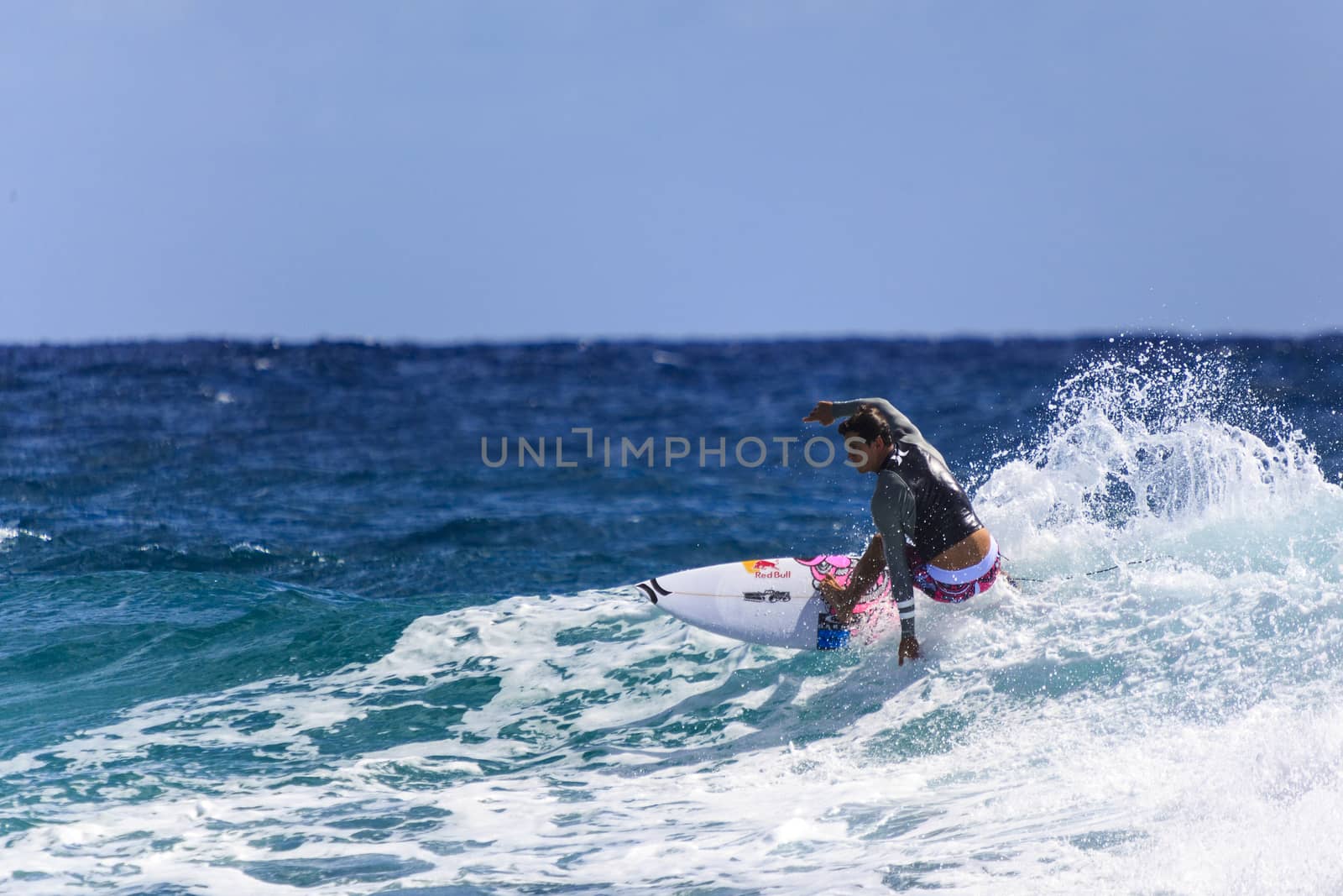 SNAPPER ROCKS, GOLD COAST, AUSTRALIA - 9 MARCH: Unidentified Surfer races the Quiksilver & Roxy Pro World Title Event. 9 March 2013, Snapper Rocks, Gold Coast, Australia