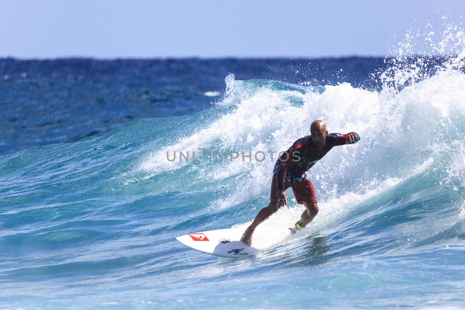 SNAPPER ROCKS, GOLD COAST, AUSTRALIA - 9 MARCH: Unidentified Surfer races the Quiksilver & Roxy Pro World Title Event. 9 March 2013, Snapper Rocks, Gold Coast, Australia