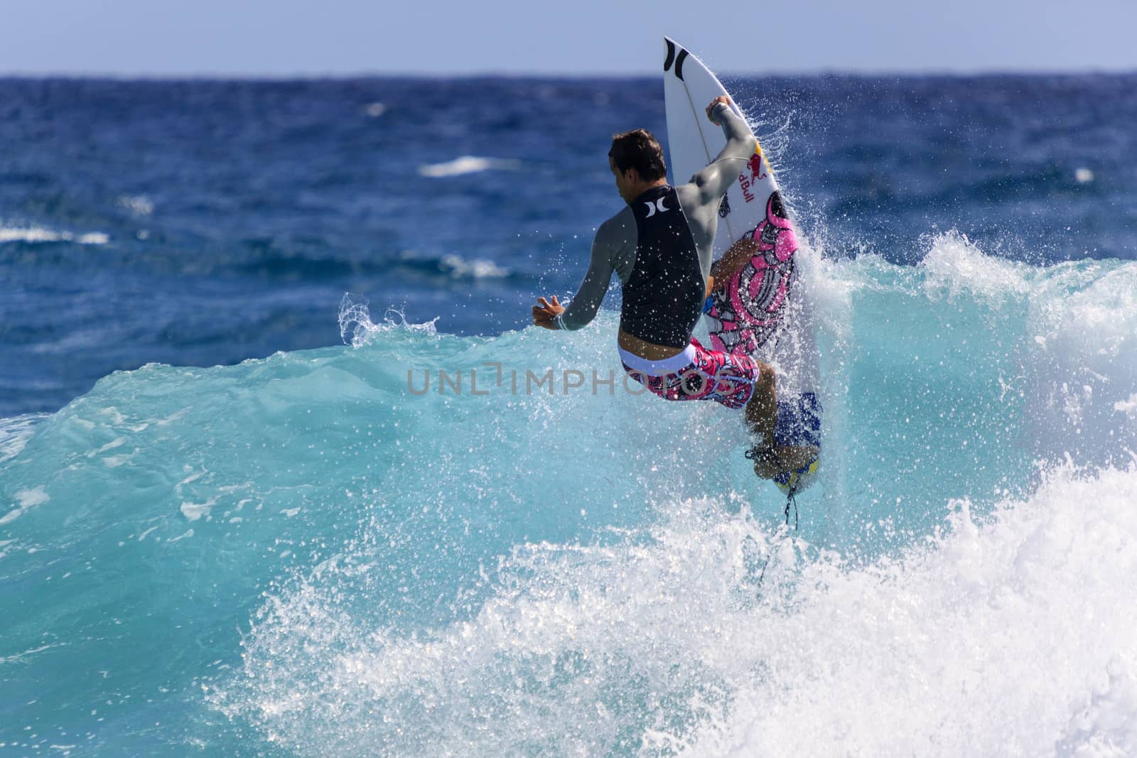 SNAPPER ROCKS, GOLD COAST, AUSTRALIA - 9 MARCH: Unidentified Surfer races the Quiksilver & Roxy Pro World Title Event. 9 March 2013, Snapper Rocks, Gold Coast, Australia