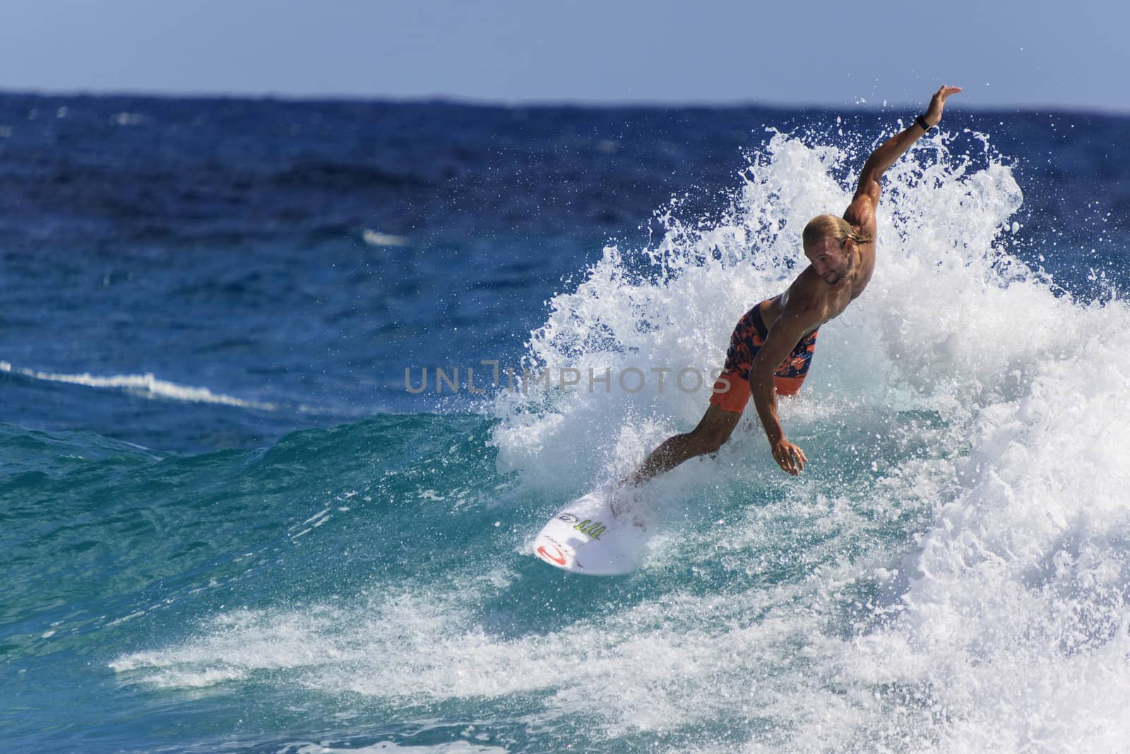 SNAPPER ROCKS, GOLD COAST, AUSTRALIA - 9 MARCH: Unidentified Surfer races the Quiksilver & Roxy Pro World Title Event. 9 March 2013, Snapper Rocks, Gold Coast, Australia