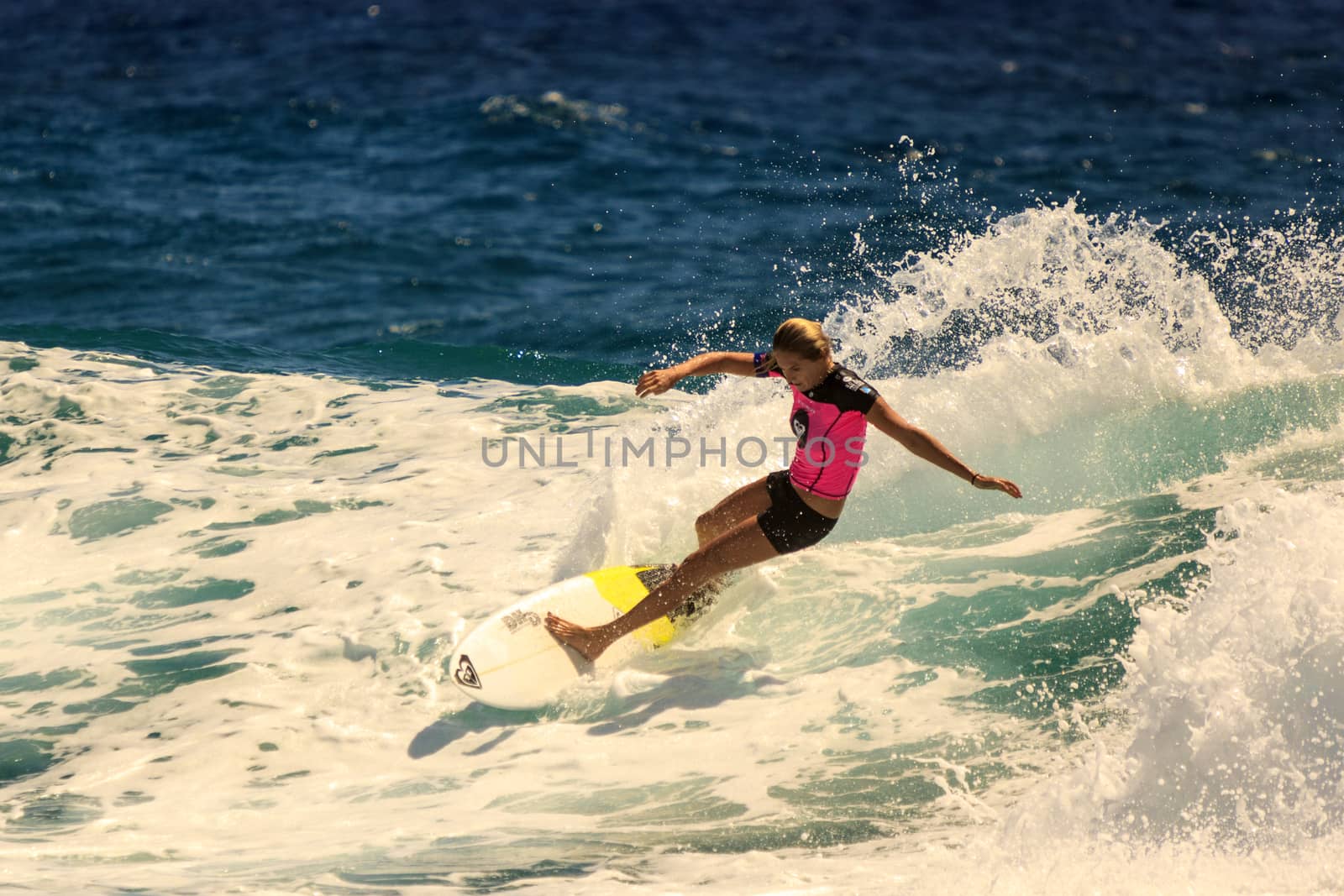 SNAPPER ROCKS, GOLD COAST, AUSTRALIA - 9 MARCH: Unidentified Surfer races the Quiksilver & Roxy Pro World Title Event. 9 March 2013, Snapper Rocks, Gold Coast, Australia