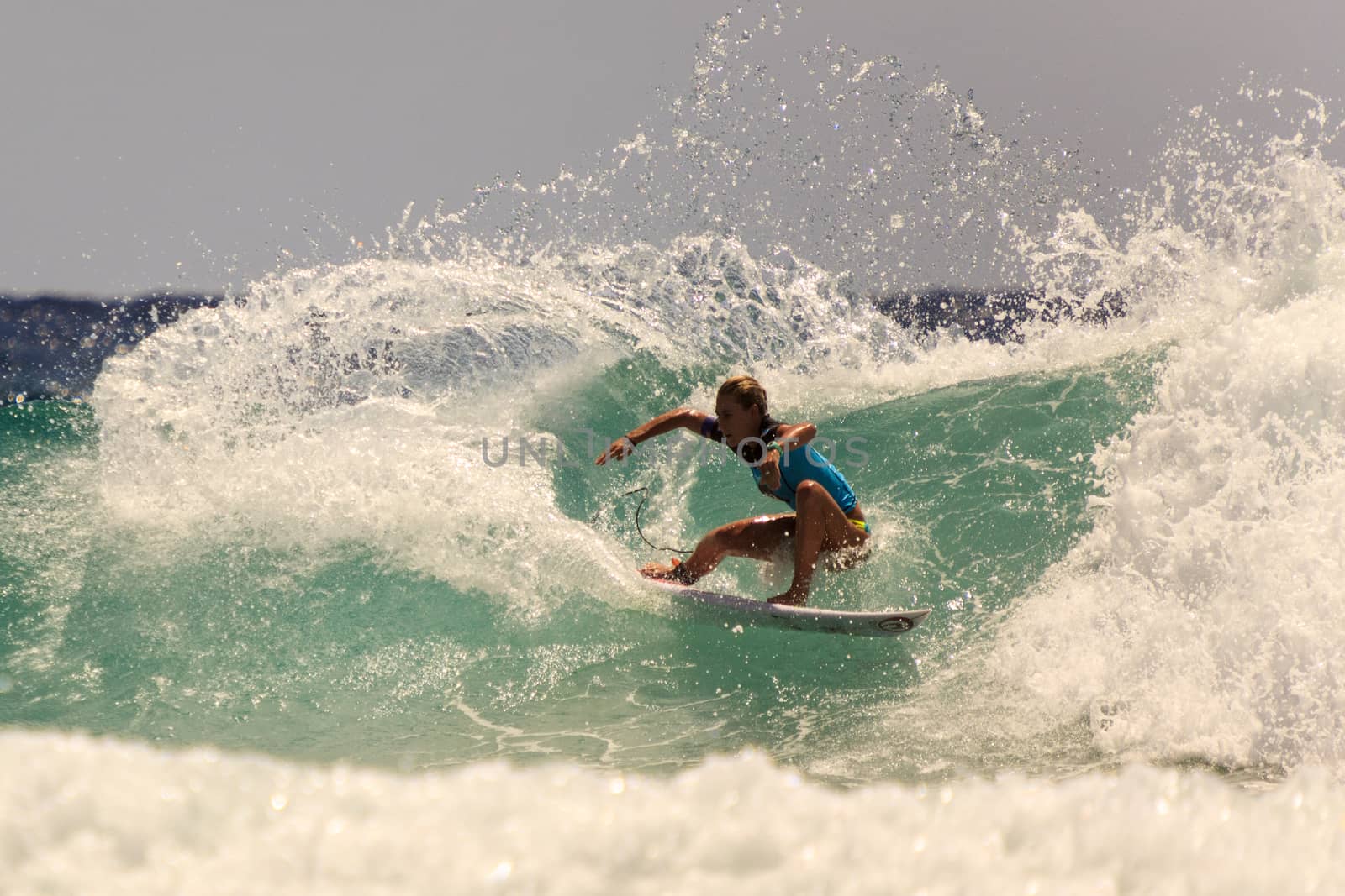 SNAPPER ROCKS, GOLD COAST, AUSTRALIA - 9 MARCH: Unidentified Surfer races the Quiksilver & Roxy Pro World Title Event. 9 March 2013, Snapper Rocks, Gold Coast, Australia