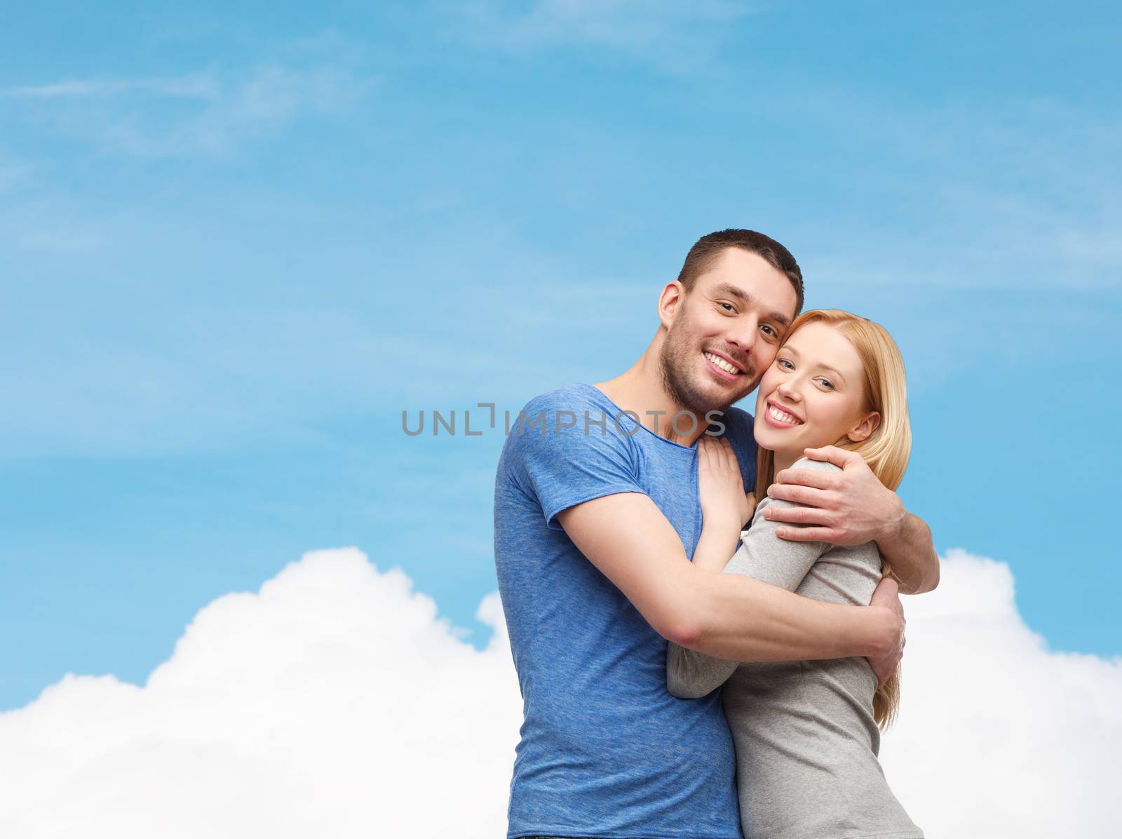 love and family concept - smiling couple hugging