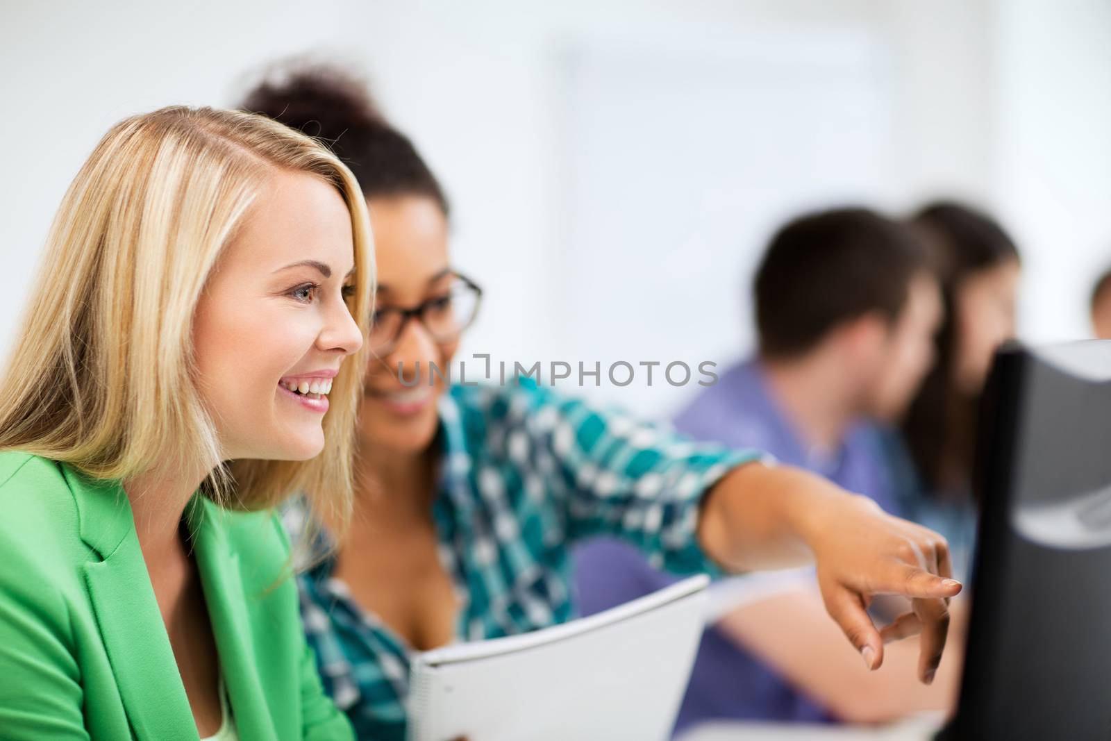 education, technology and internet - students with computer studying at school