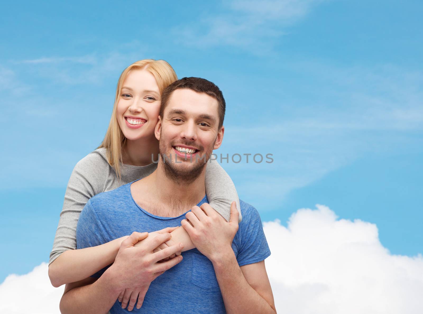 love and family concept - smiling couple hugging