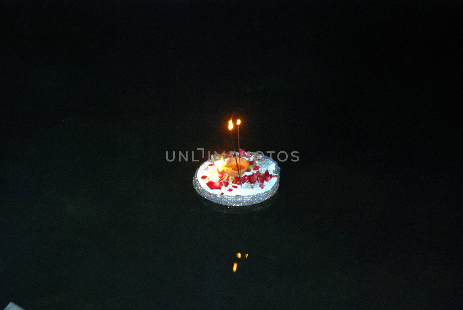 PAKISTAN, Karachi :  Married Hindu women and their husband light candles at the Netty Jetty temple during the Karva Chauth festival in Karachi on October 30, 2015. Married women observe Karvachauth by fasting and offering prayers seeking welfare, prosperity, and longevity of their husbands.