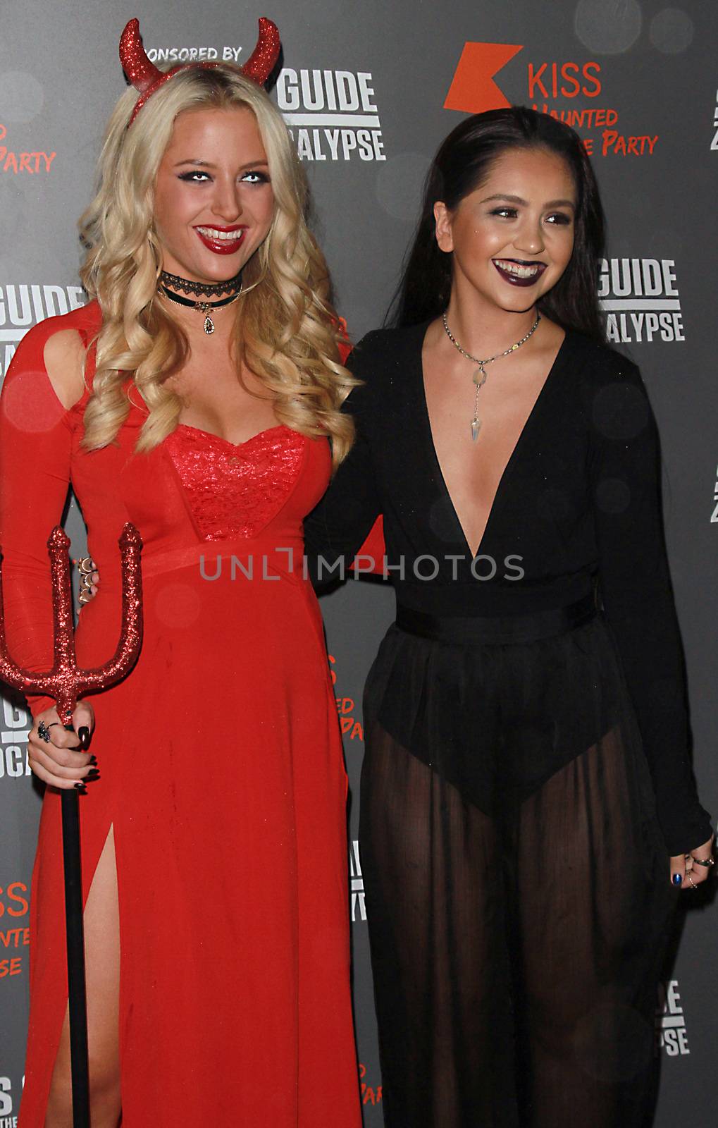 ENGLAND, London: Chloe Paige and Havva Rebke attend the Kiss FM Haunted House Party in London on October 29, 2015. Costumes ranging from the Rock band KISS to the devil were on display as various stars walked the red carpet at the party which featured musical performances by Rita Ora, Jason Derulo and band Little Mix.