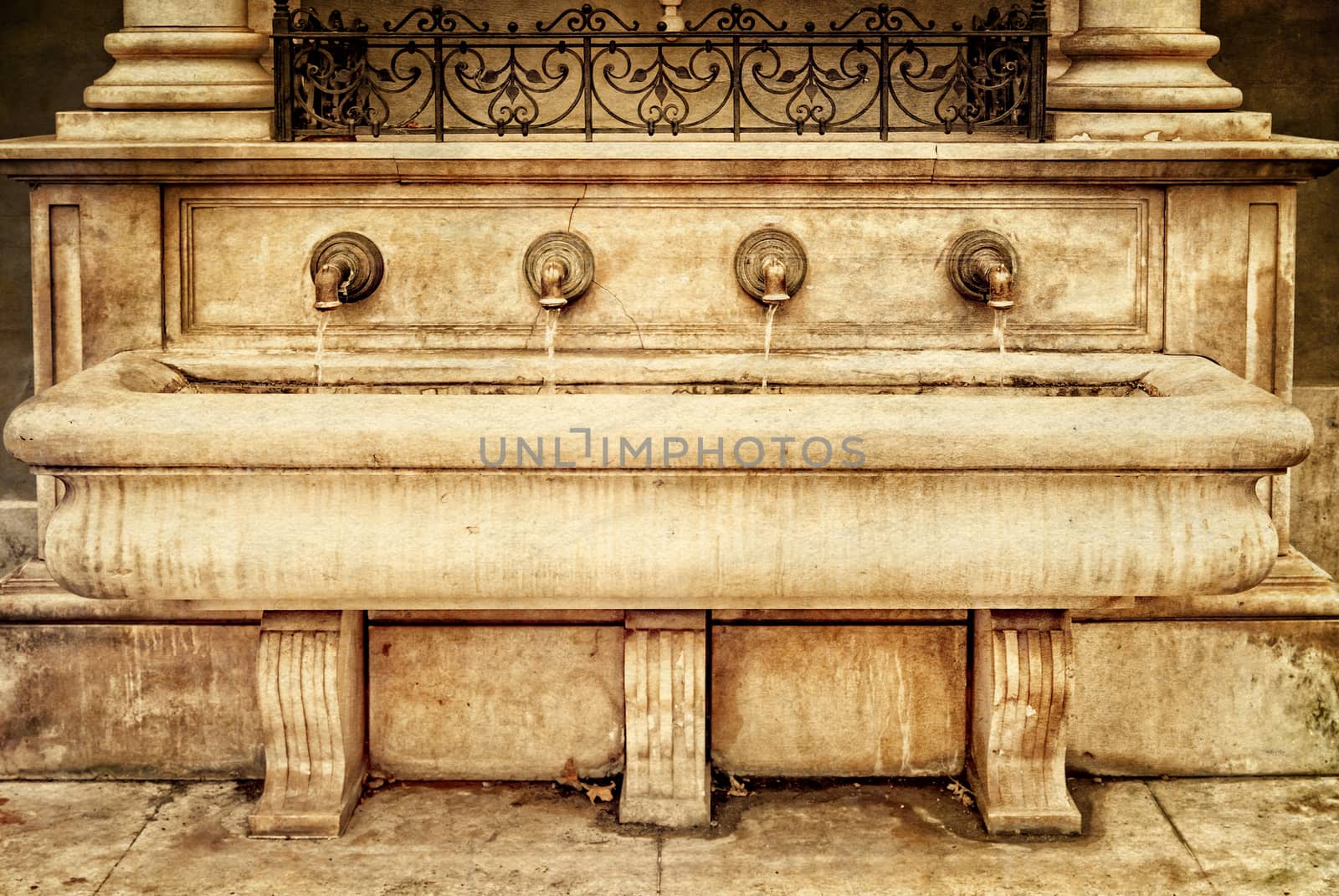 Fountain St. Stephen's in the medieval city  Eger. Hungary. Photo in old color image style.