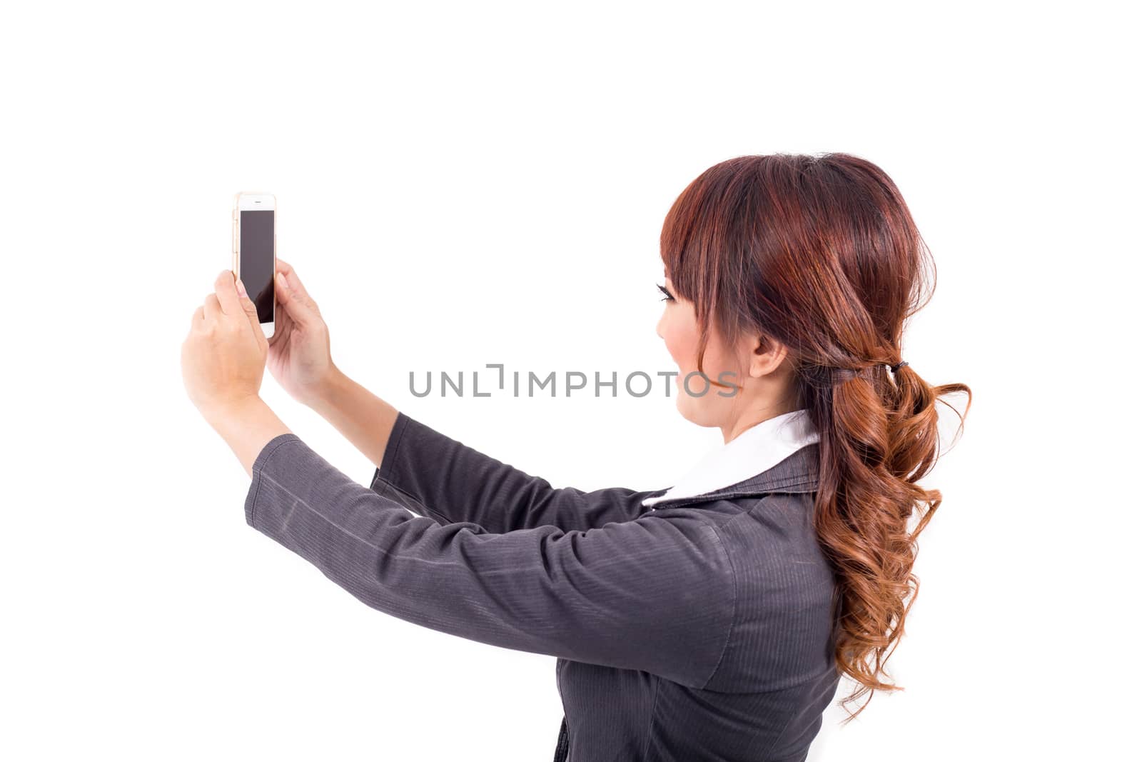 Young business woman holding cellphone on white backgroundYoung business woman holding cellphone on white background