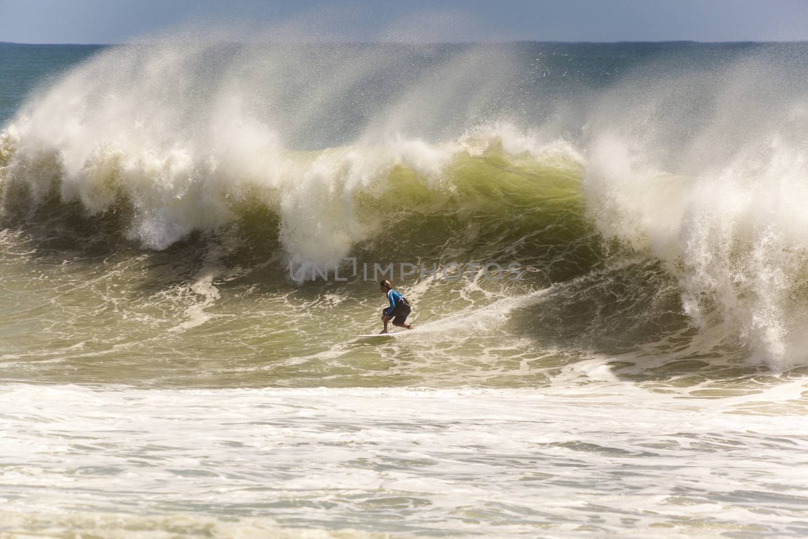 SNAPPER ROCKS, GOLD COAST, AUSTRALIA - FEB 26: Unidentified Surfer races the Quiksilver & Roxy Pro World Title Event. February 26, 2012, Snapper Rocks, Gold Coast, Australia