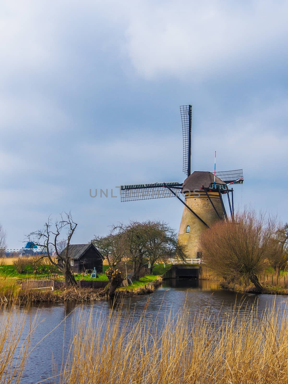 ROTTERDAM, NETHERLANDS - April 13, 2013 : The beautiful winter windmill landscape in the countryside of Netherlands