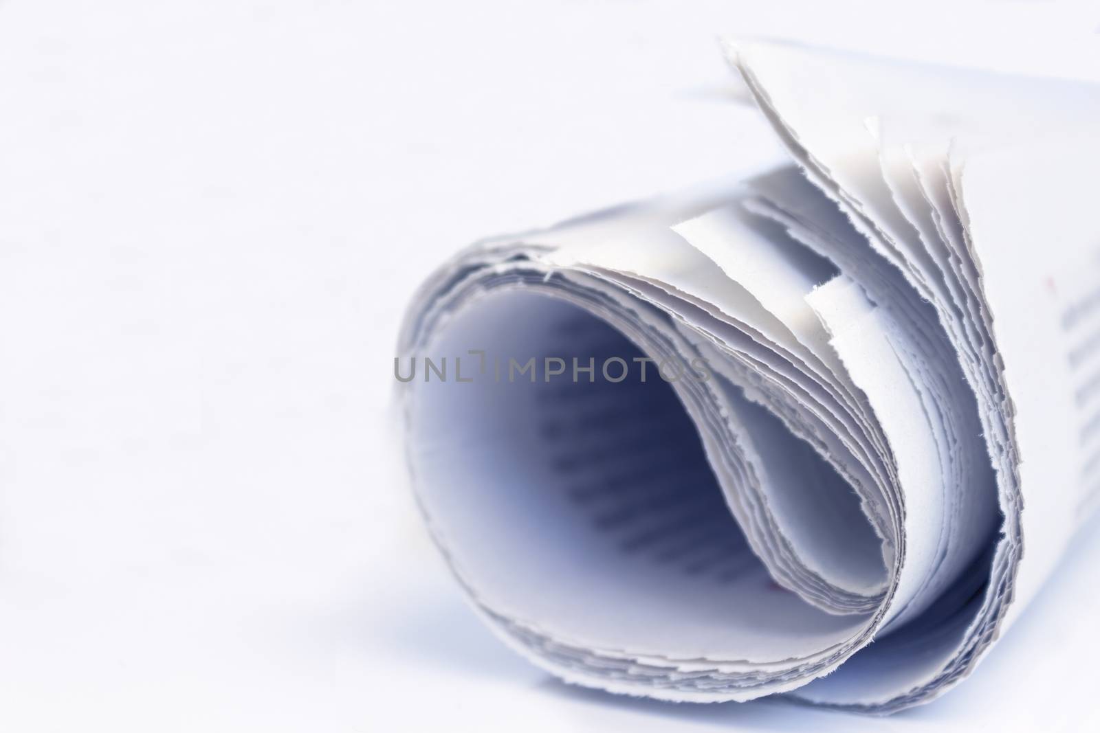 Rolled newspaper close up