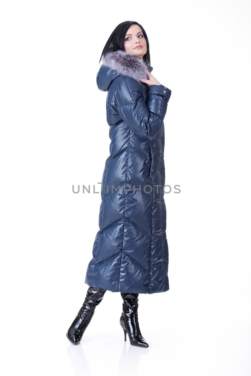 Young attractive woman in fashionable clothing on isolated background