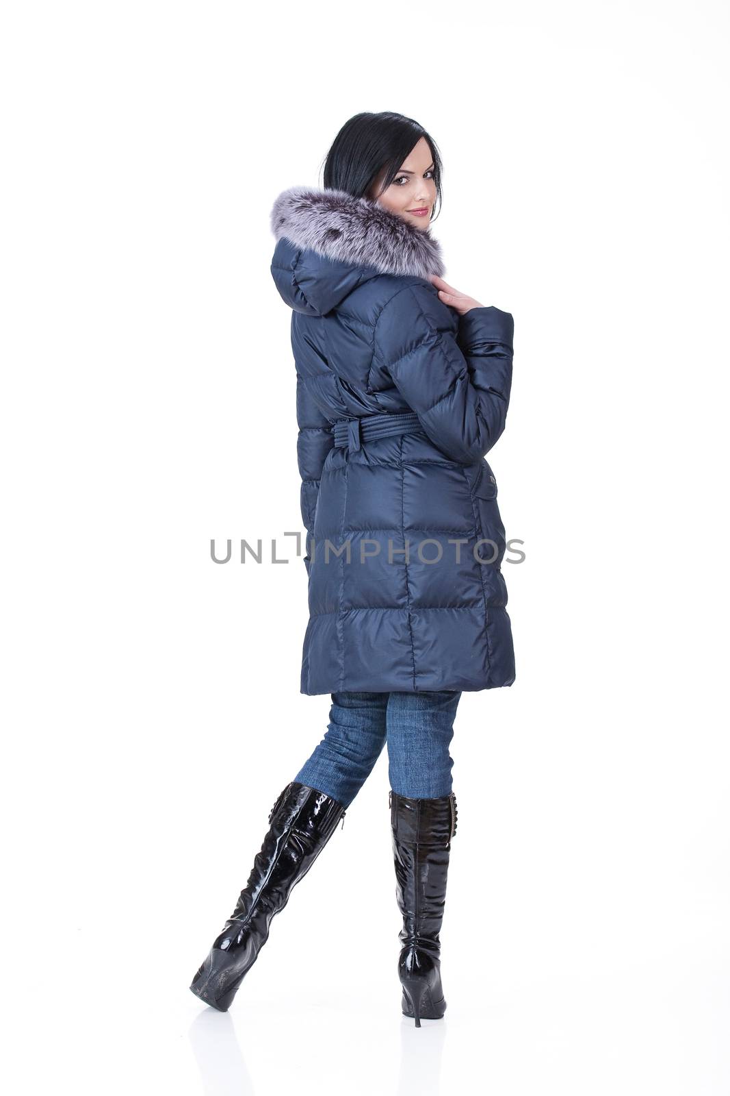 Young attractive woman in fashionable clothing on isolated background