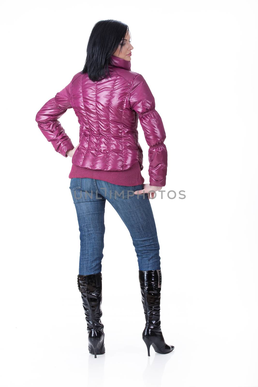 Young attractive woman in fashionable clothing on isolated background