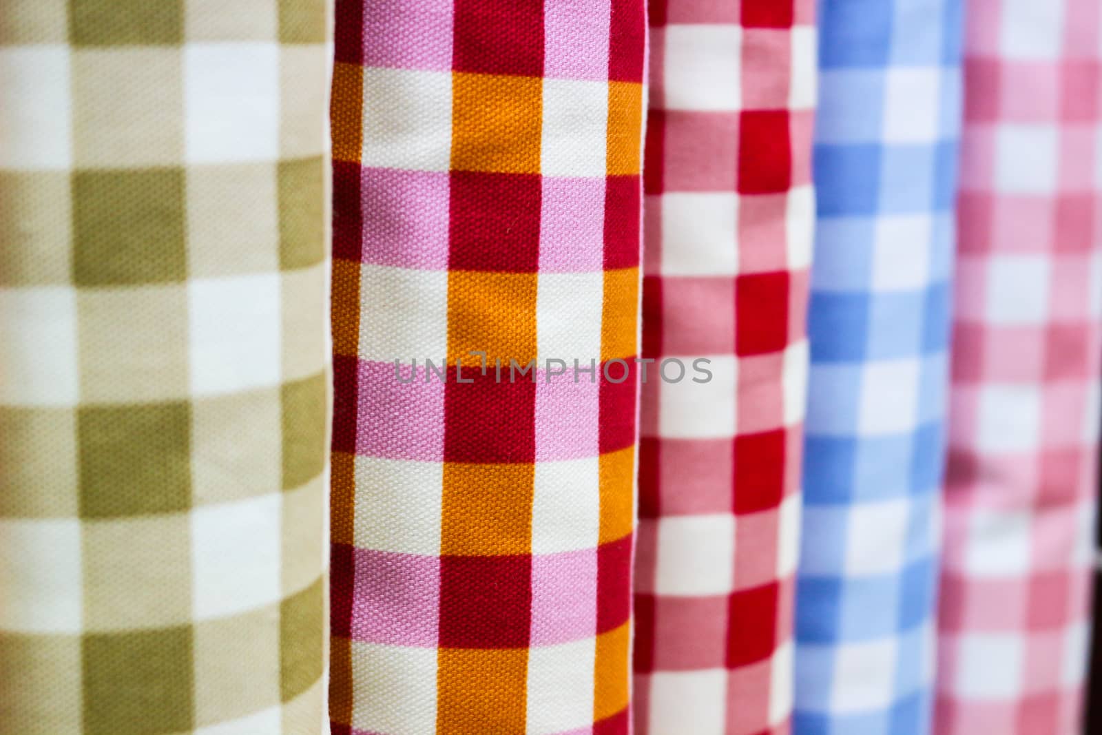 Rolls of colorful fabric by shallow depth of field  focus