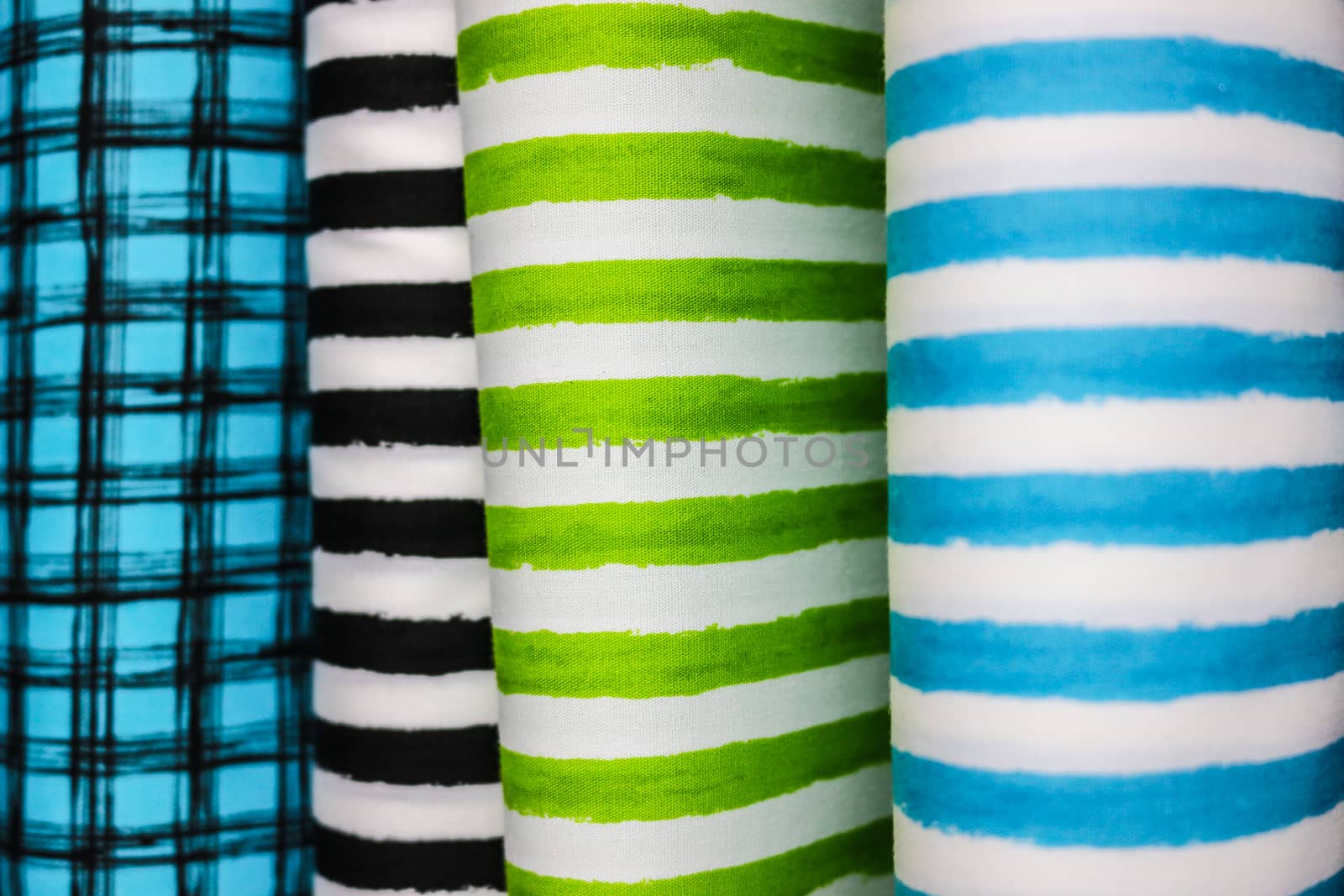 Rolls of colorful fabric by shallow depth of field  focus