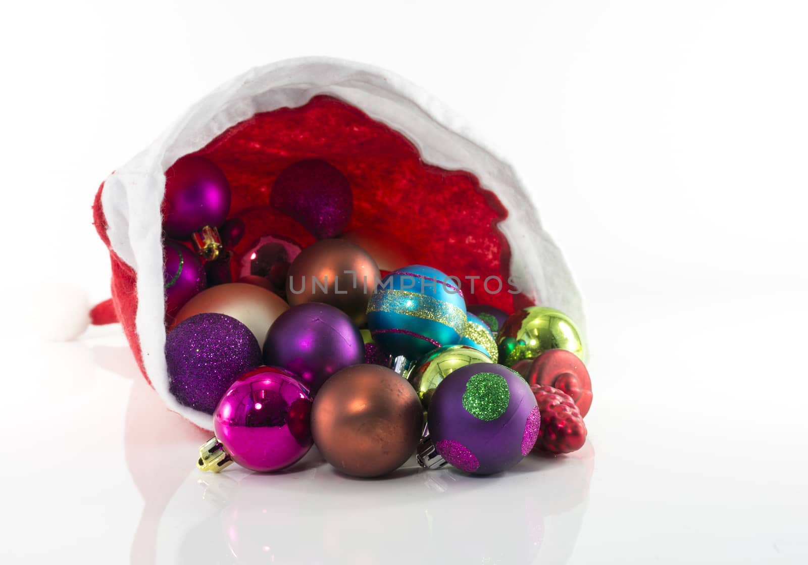 santa hat with christmas balls isolated on white