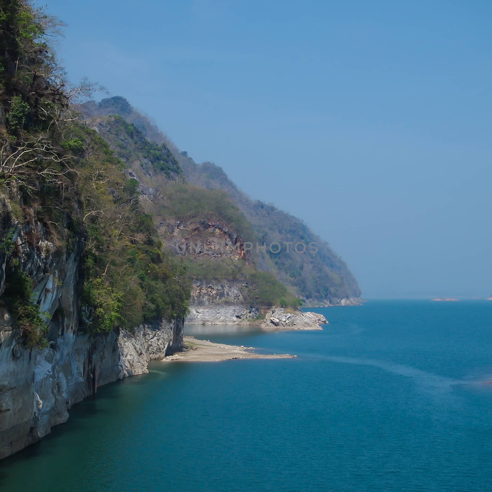 image of blue lake , mountains and sky of the dam