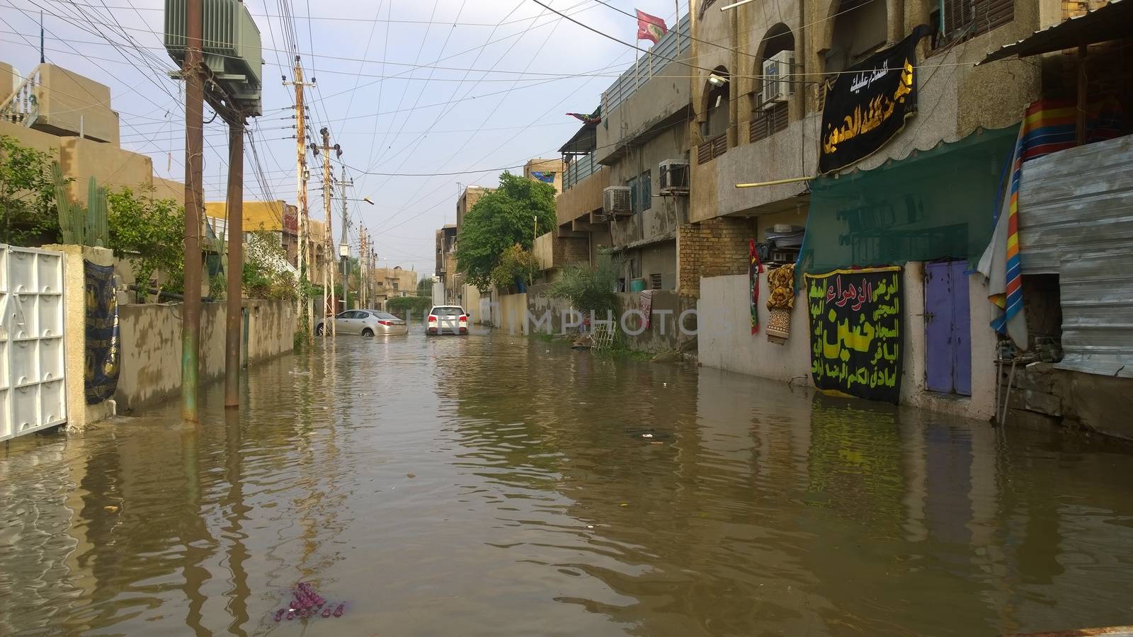  IRAQ, Baghdad : A street of Baghdad, Iraq, under the water after heavy rains on October 29, 2015, resulting a major flooding. According to a spokesman for the meteorological department, more than 2 inches of rain fell on the city in 24 hours. Some motorists were forced to leave their cars when they became stuck in deep water.  	