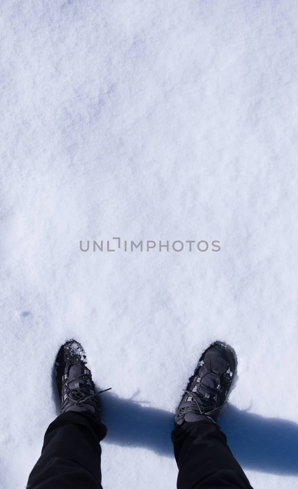 men legs stand on snow