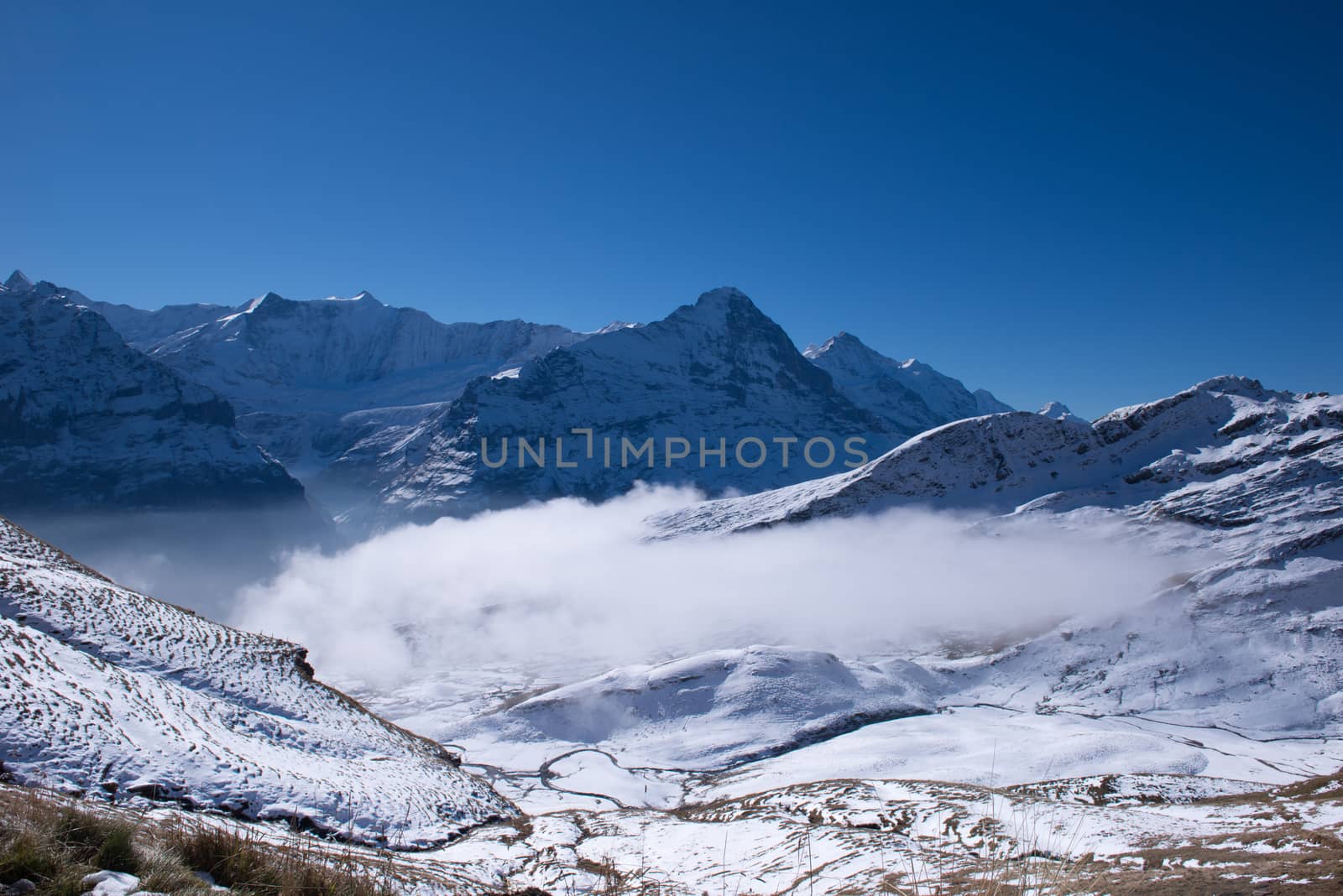 first mountain and the snow peaks of Jungfrau region grindelwald switzerland