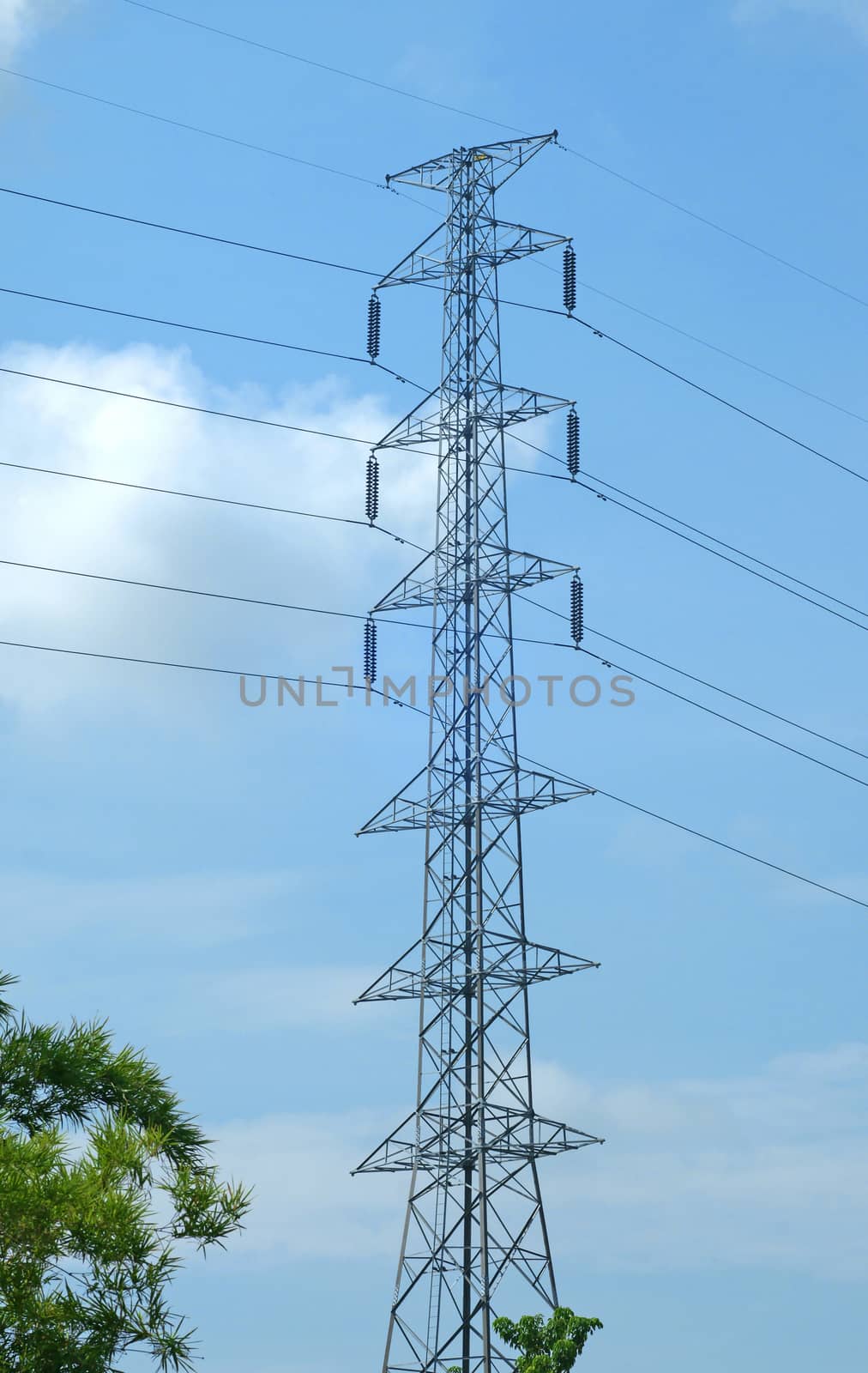 High voltage post or power transmission line tower and blue sky by mranucha