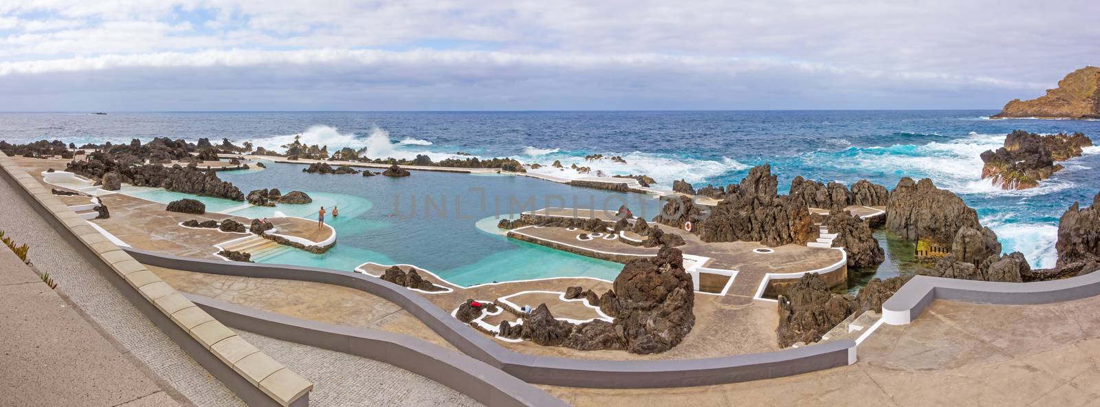 Porto Moniz, Portugal - June 2, 2013: Panorama of natural rock pool of Porto Moniz. It is a public bath with water from the Atlantic Ocean.