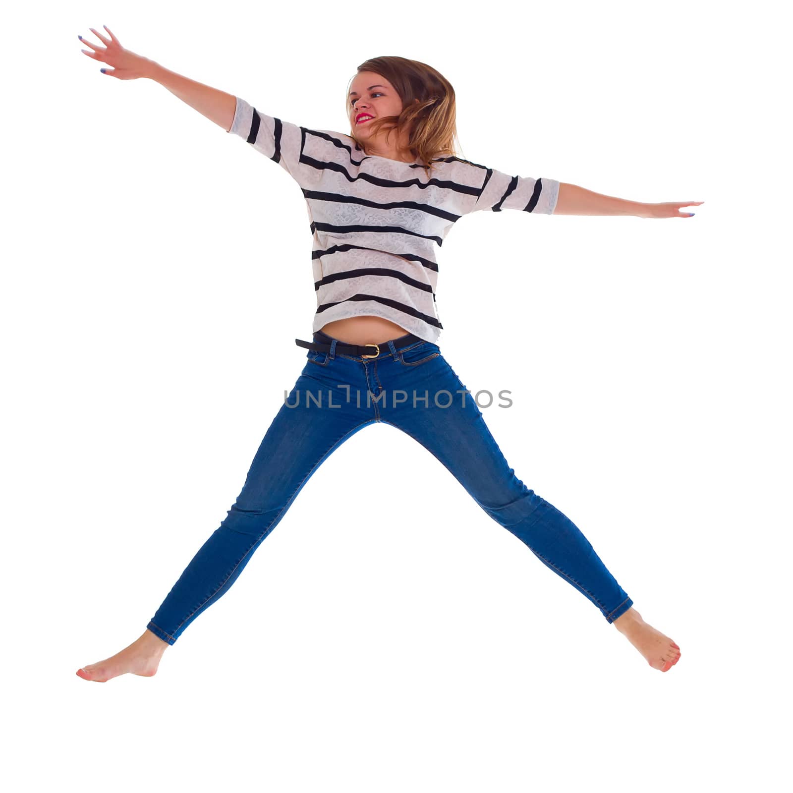a young woman in jeans jumping. isolate
