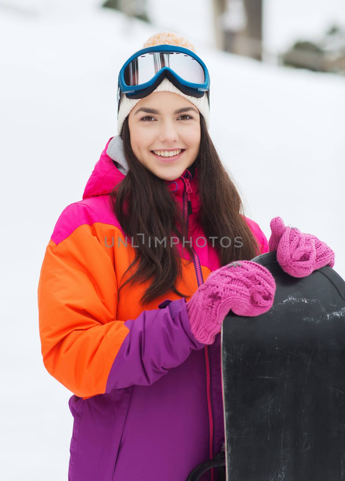 happy young woman with snowboard outdoors by dolgachov