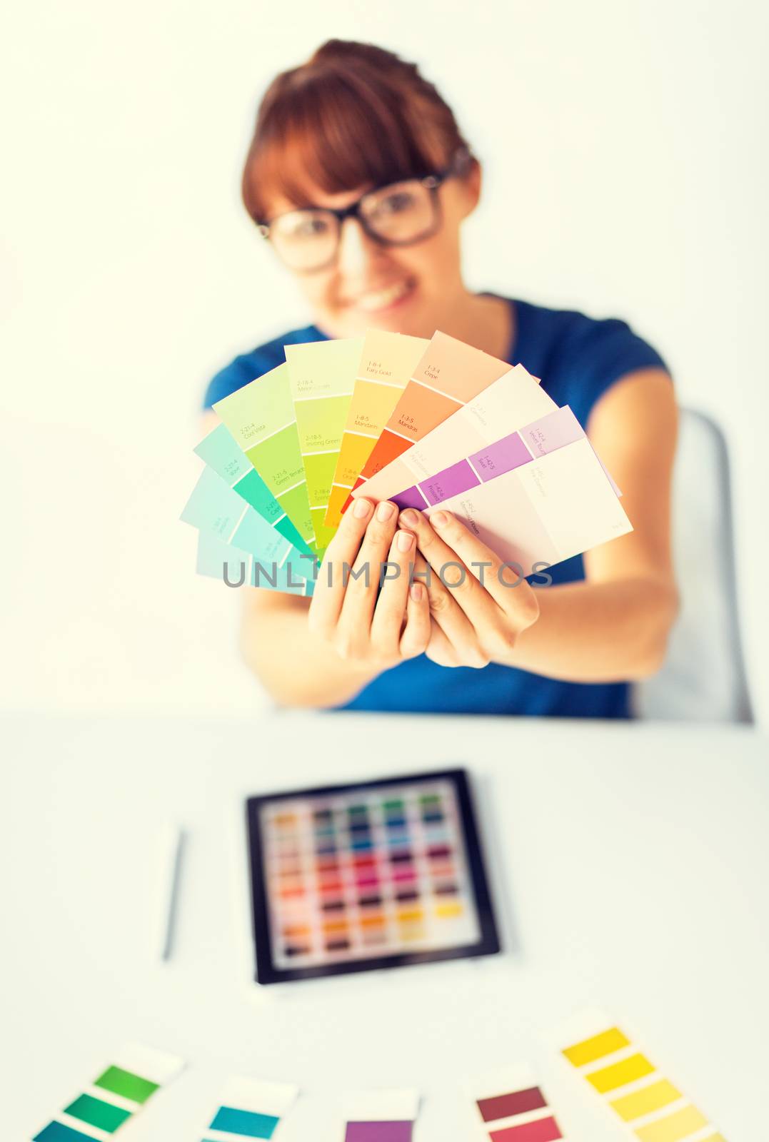 woman showing pantone color samples by dolgachov